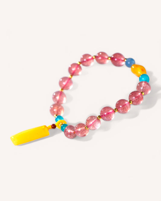 Elegant crystal bracelet with Strawberry Quartz and Aquamarine beads, designed to enhance love, intuition, and positive communication.