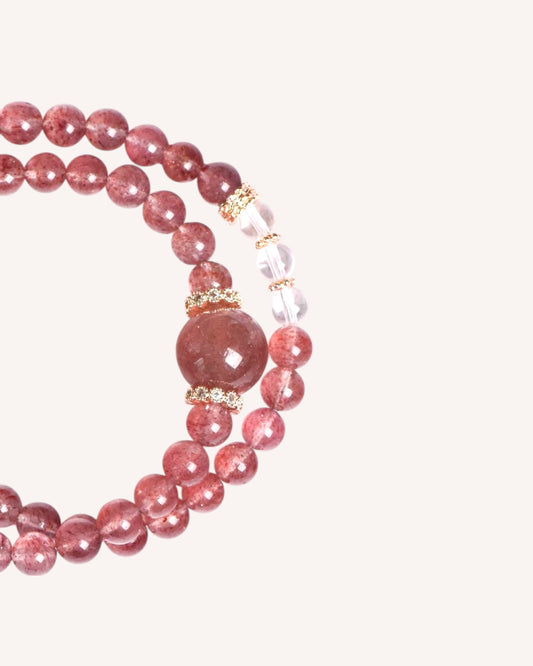 Close-up of Strawberry Quartz and White Quartz bracelet beads with energy-enhancing details