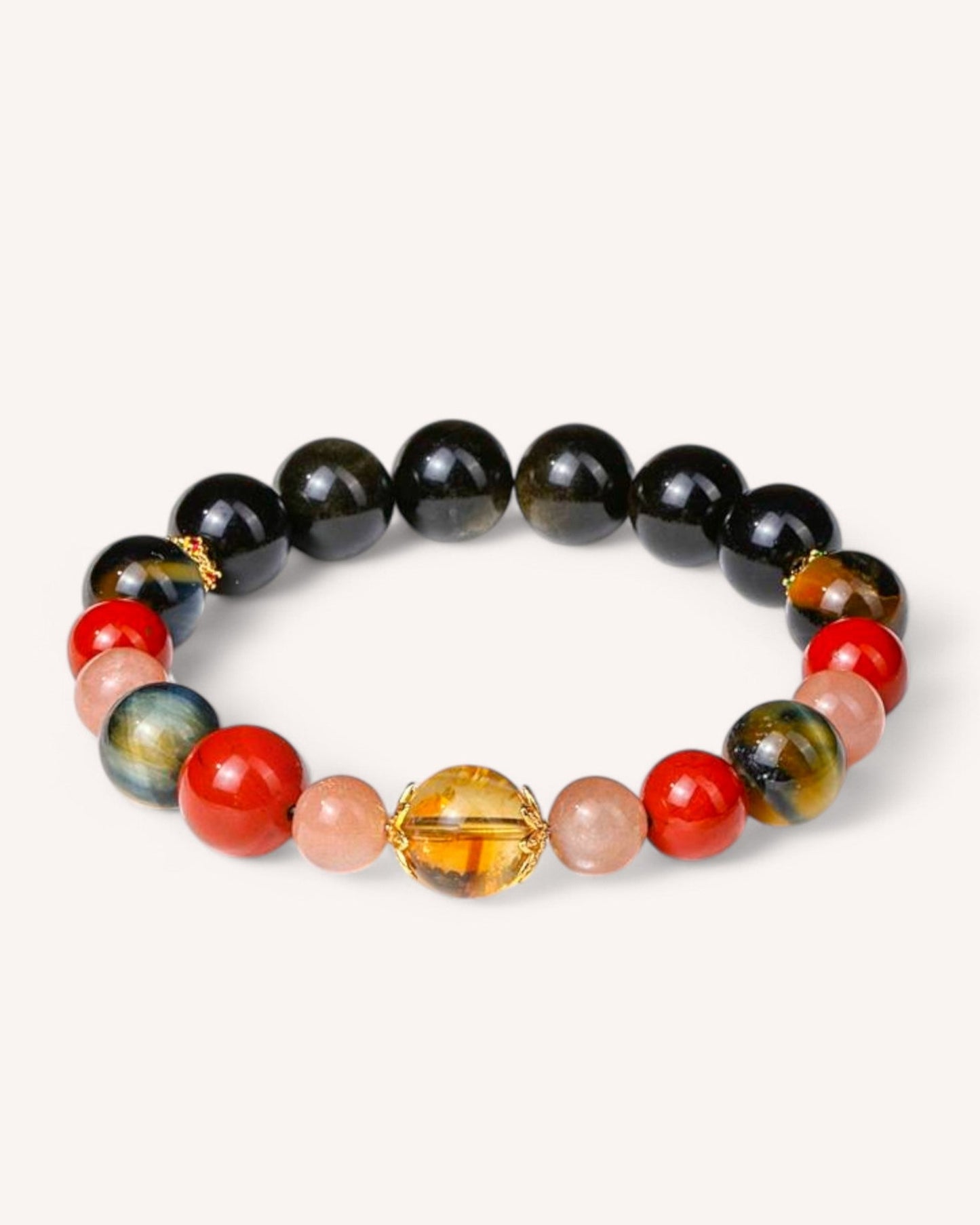 Healing bracelet combining Tiger’s Eye, Black Obsidian, Red Agate, Sunstone, and Citrine to attract success, strength, and positive energy.