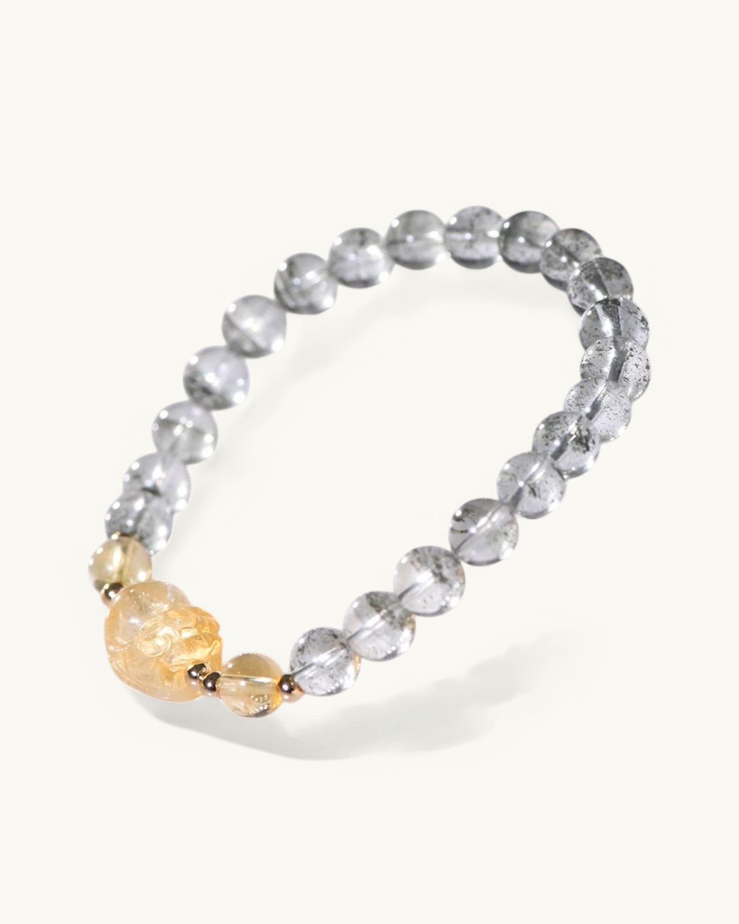 Side angle of Green Phantom Quartz with Pixiu Citrine charm bracelet for abundance, business success, and energy cleansing.