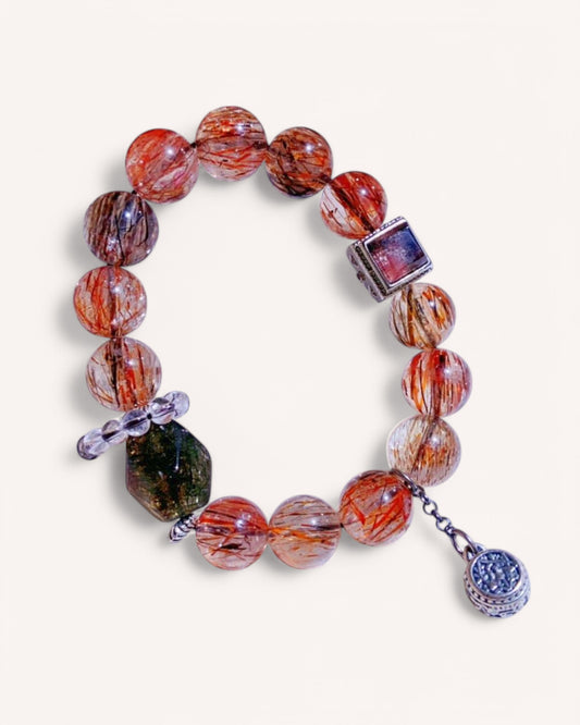 Spiritual healing bracelet featuring Black Gold Super Seven and Black Rutilated Quartz with s999 silver charm