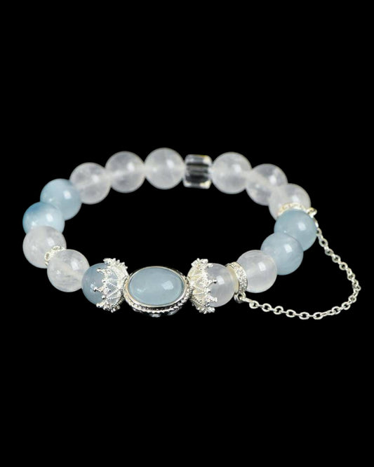 Side angle of White Phantom, Aquamarine, and White Quartz Bracelet showcasing bead shine and crystal clarity.