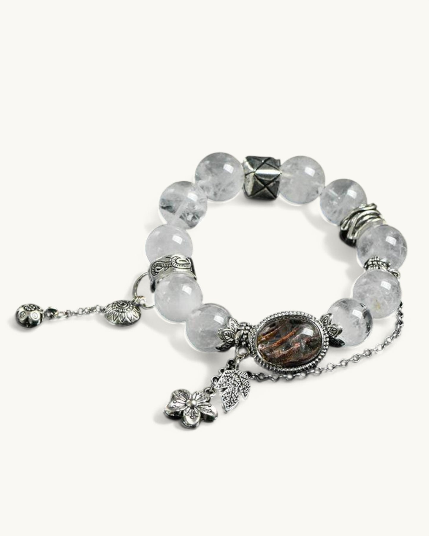 Close-up front view of White Phantom and Four Seasons Phantom bracelet with silver chain and carved accent