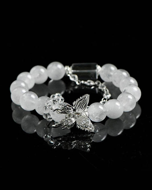 "White Phantom Quartz healing bracelet with butterfly charm, front view for emotional clarity and spiritual renewal"