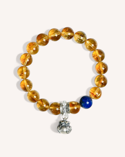 Yellow Azetulite & Lapis Lazuli Bracelet – A prosperity and wisdom energy bracelet designed to attract wealth, amplify intuition, and enhance confidence. Features a silver accent for balance and energy flow.