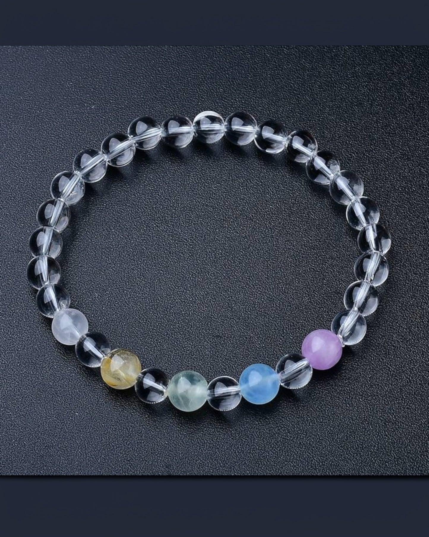 A Chakra Healing White Quartz Bracelet with rutilated quartz, aquamarine, lavender amethyst, and white quartz beads, designed for spiritual clarity and energy balance.