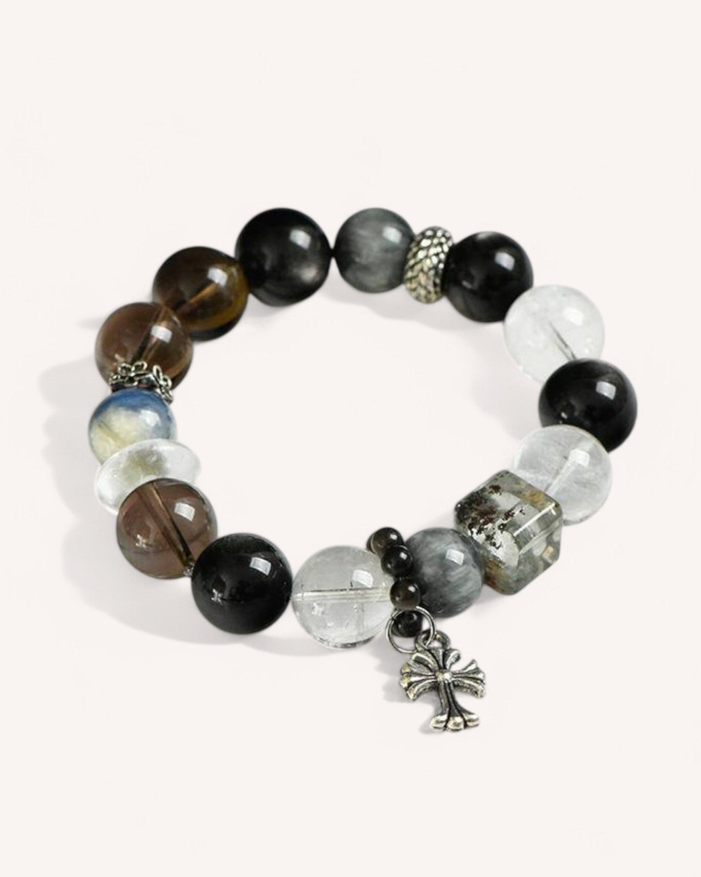Empowerment & Protection Bracelet made with Tiger Eye, Quartz, and Silver Obsidian. A stylish energy shield bracelet that enhances focus, sharpens intuition, and blocks negativity for personal strength.