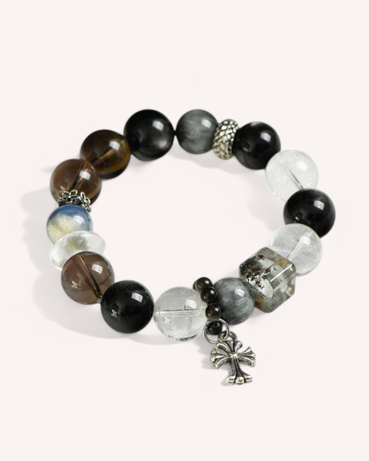 Empowerment & Protection Bracelet made with Tiger Eye, Quartz, and Silver Obsidian. A stylish energy shield bracelet that enhances focus, sharpens intuition, and blocks negativity for personal strength.