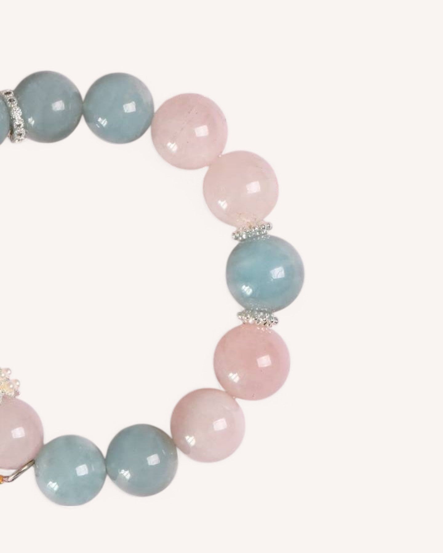 A beautiful Aquamarine & Rose Quartz bracelet designed for emotional healing, self-love, and stress relief. Features a delicate charm for added elegance.
