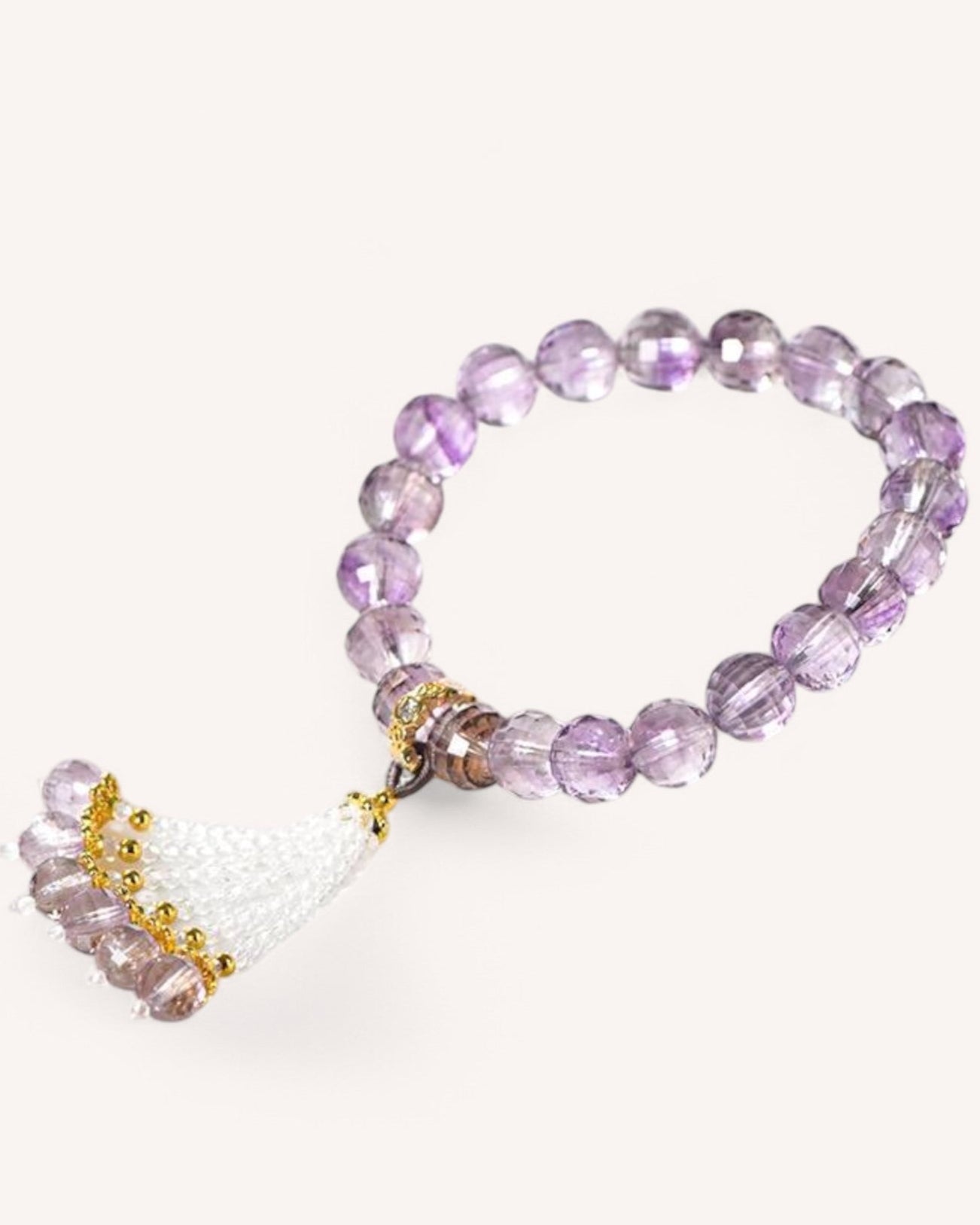 Elegant amethyst healing bracelet with tassel design, promoting energy balance, intuition, and spiritual stability. Ideal for meditation and daily wear.