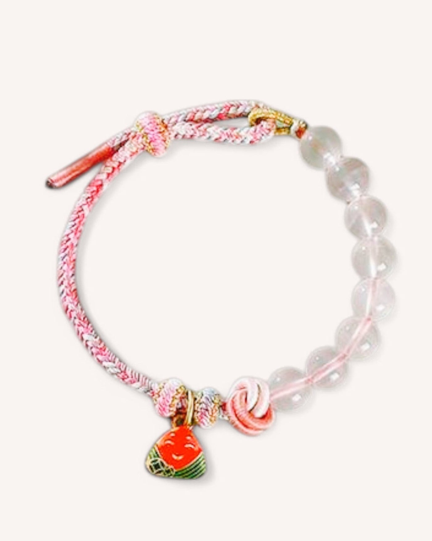 Close-up of the Rose Quartz Woven Bracelet, featuring white quartz and a pink woven cord, designed for focus, confidence, and emotional balance.
