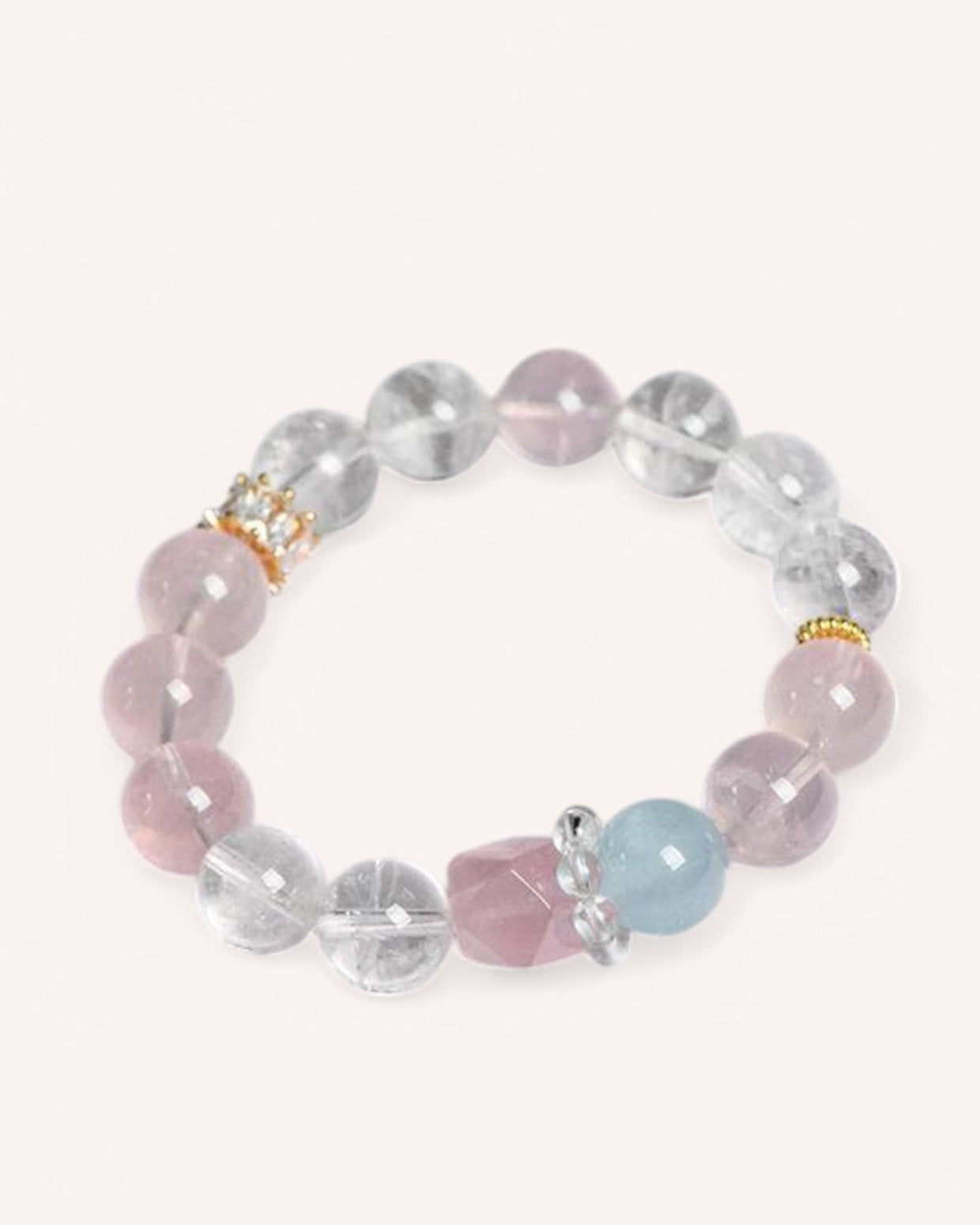 A delicate Rose Quartz and White Quartz bracelet with aquamarine accents, designed to enhance emotional healing, mental clarity, and love energy. Perfect for self-care and deep connections.