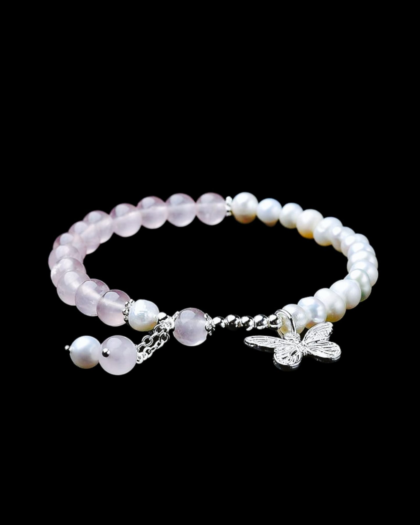 Elegant Rose Quartz & Pearl Bracelet featuring a delicate butterfly charm, symbolizing love, transformation, and emotional healing. Perfect for self-care and new beginnings.
