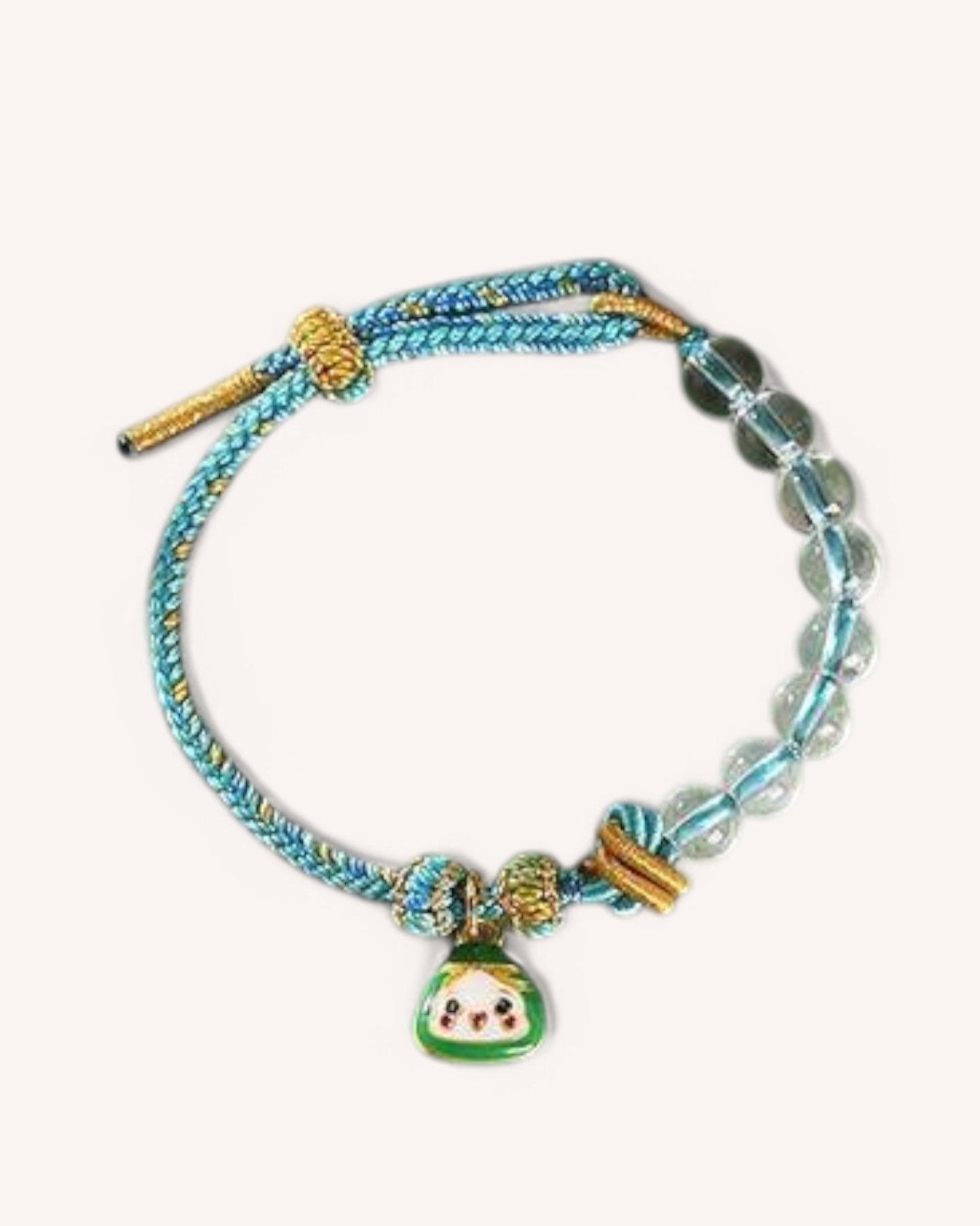 Close-up of the Fortune Flow Bracelet, featuring White Quartz beads and a traditional lucky charm, handwoven with blue cord for stability and abundance energy.

图片 3
