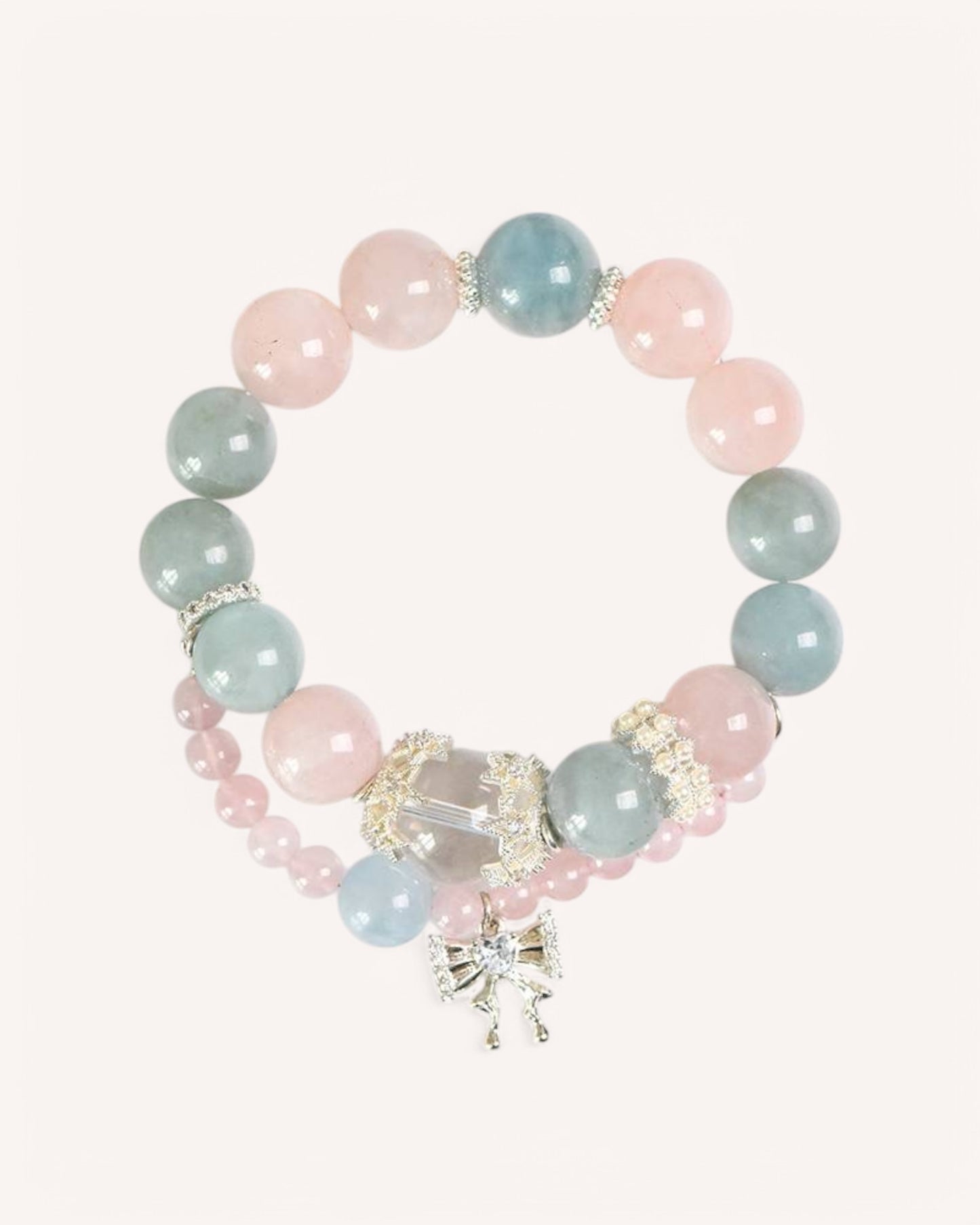 A double-layer Aquamarine & Rose Quartz bracelet with an elegant charm, designed to enhance clarity, emotional balance, and spiritual well-being.