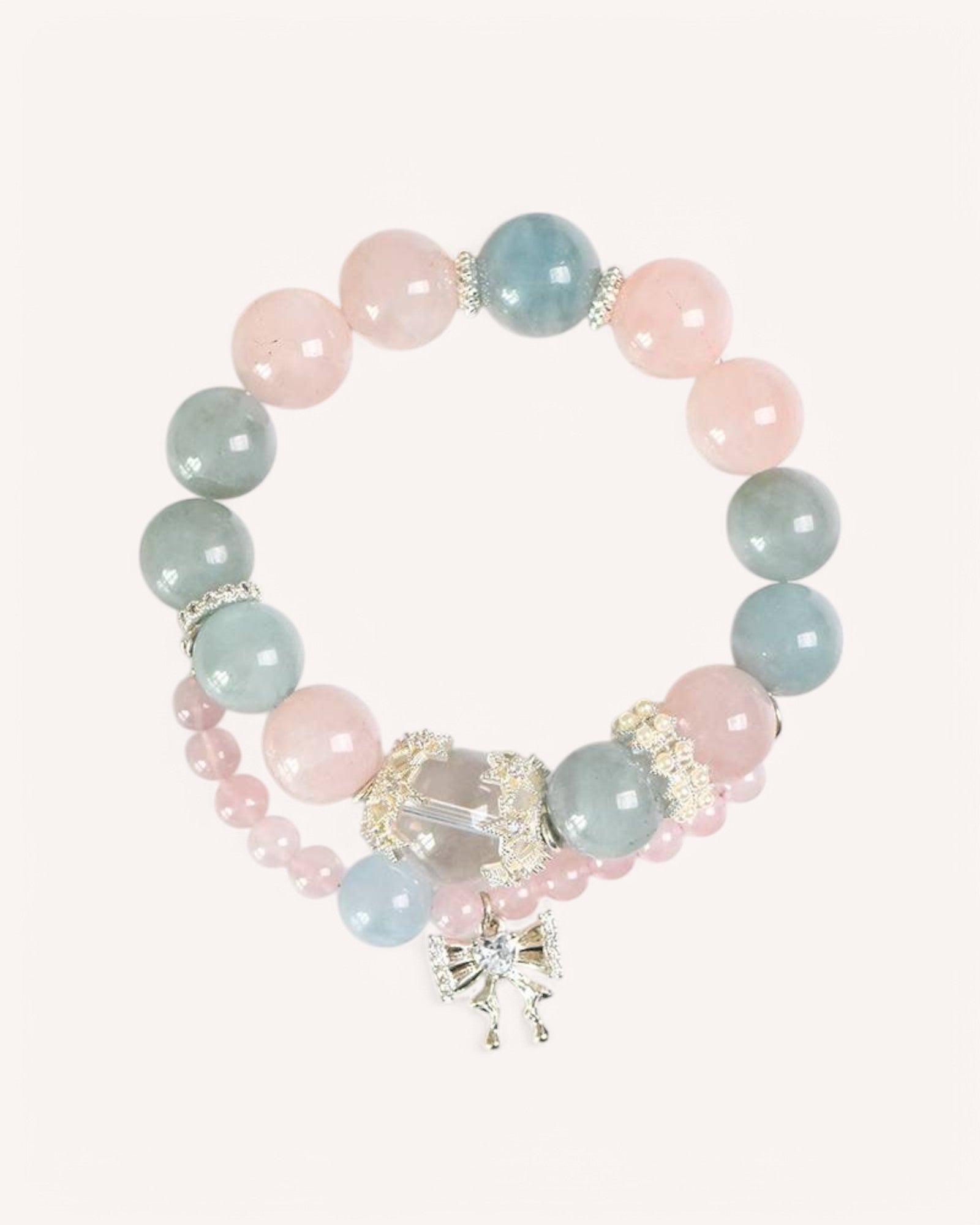 A double-layer Aquamarine & Rose Quartz bracelet with an elegant charm, designed to enhance clarity, emotional balance, and spiritual well-being.