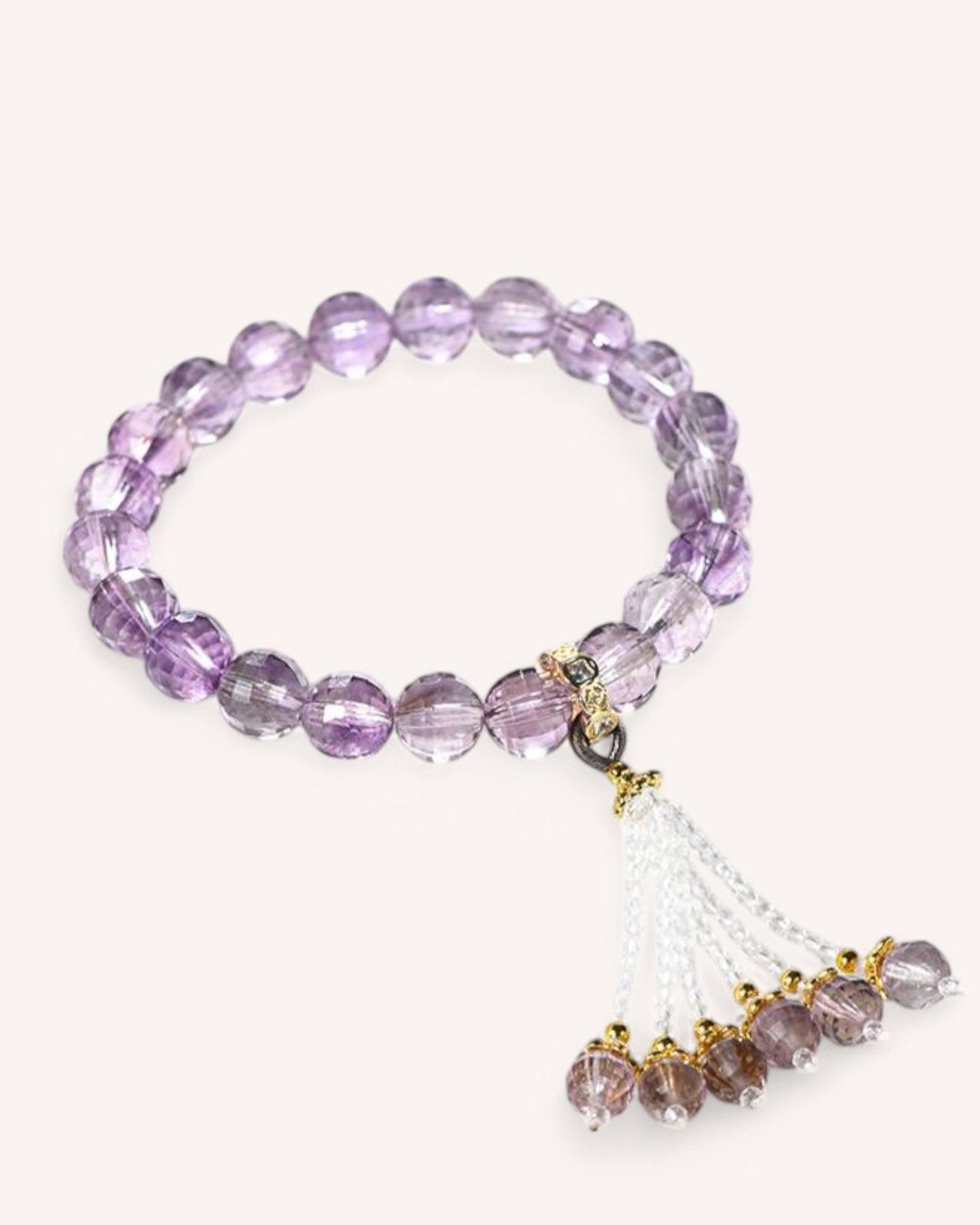 High-quality amethyst crystal bracelet with flowing tassel, designed for spiritual protection, emotional stability, and enhanced intuition.