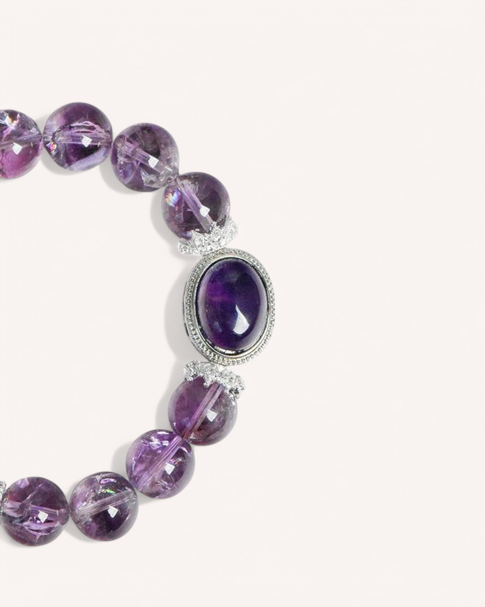 Close-up shot of the amethyst gemstone bracelet, highlighting the deep purple beads and silver embellishments, crafted for protection, relaxation, and mental clarity.