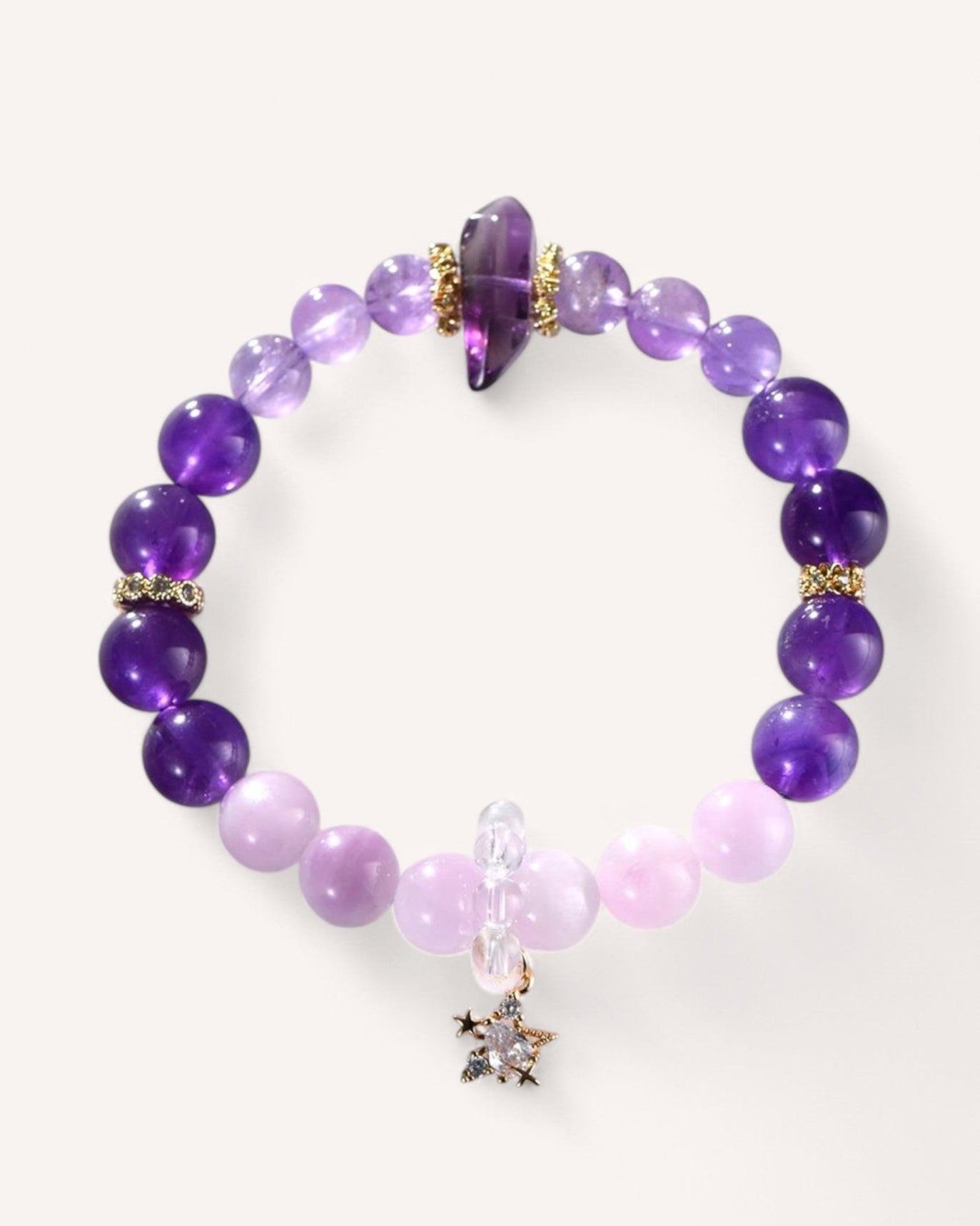 Close-up of the Amethyst & Kunzite Nine-Tailed Fox Bracelet, featuring deep purple amethyst beads for clarity, soft kunzite for emotional healing, and a mystical nine-tailed fox charm symbolizing transformation and spiritual shielding.