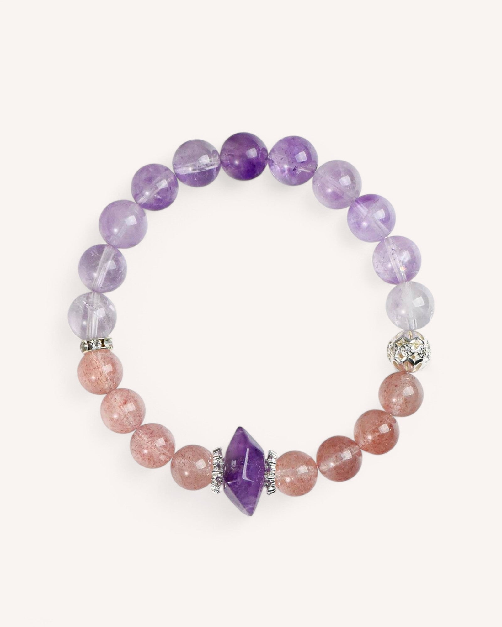 Amethyst and Strawberry Quartz bracelet for emotional healing and balance. Designed to enhance love, clarity, and self-acceptance with a faceted Amethyst centerpiece.