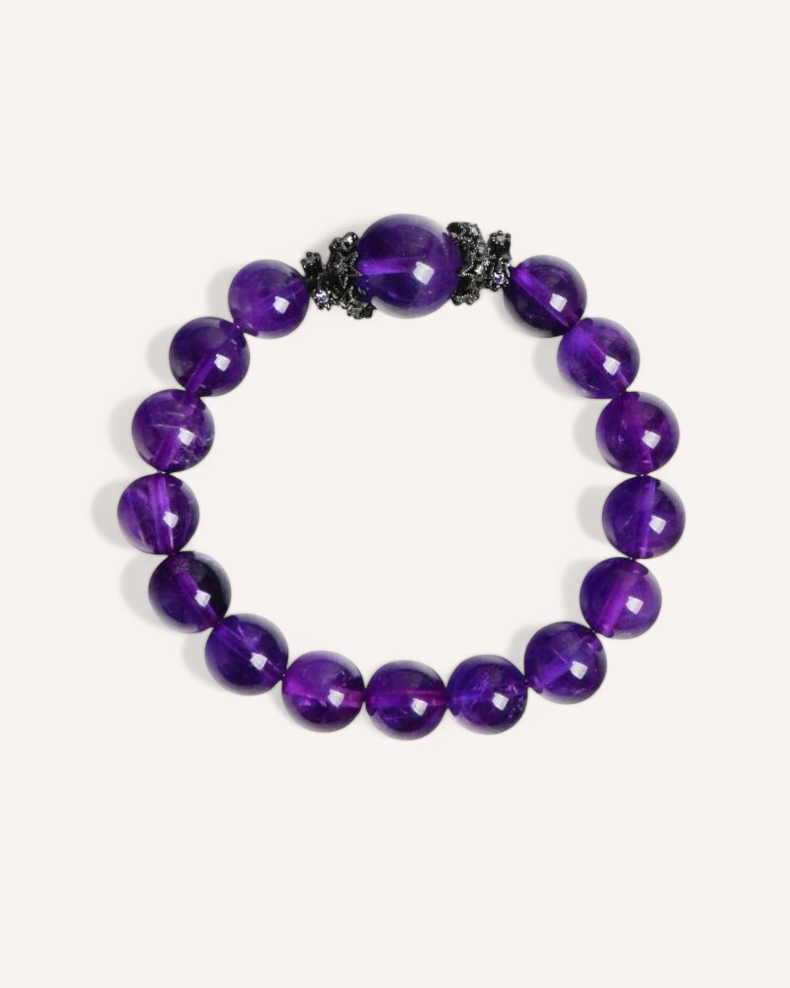 Close-up of the Amethyst Strength Bracelet featuring deep purple amethyst beads and alloy accents, designed for confidence, wisdom, and spiritual protection.
