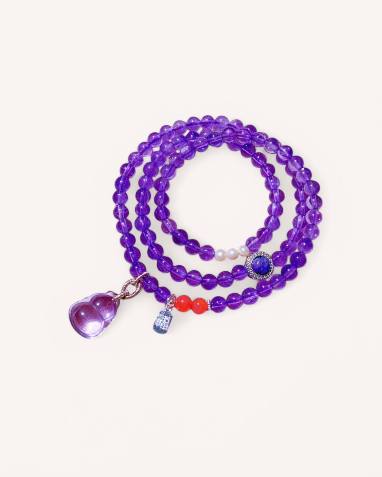 A stunning triple-wrap amethyst bracelet featuring a heart-shaped charm, designed for emotional balance, mental clarity, and spiritual protection. Ideal for meditation and daily energy alignment.