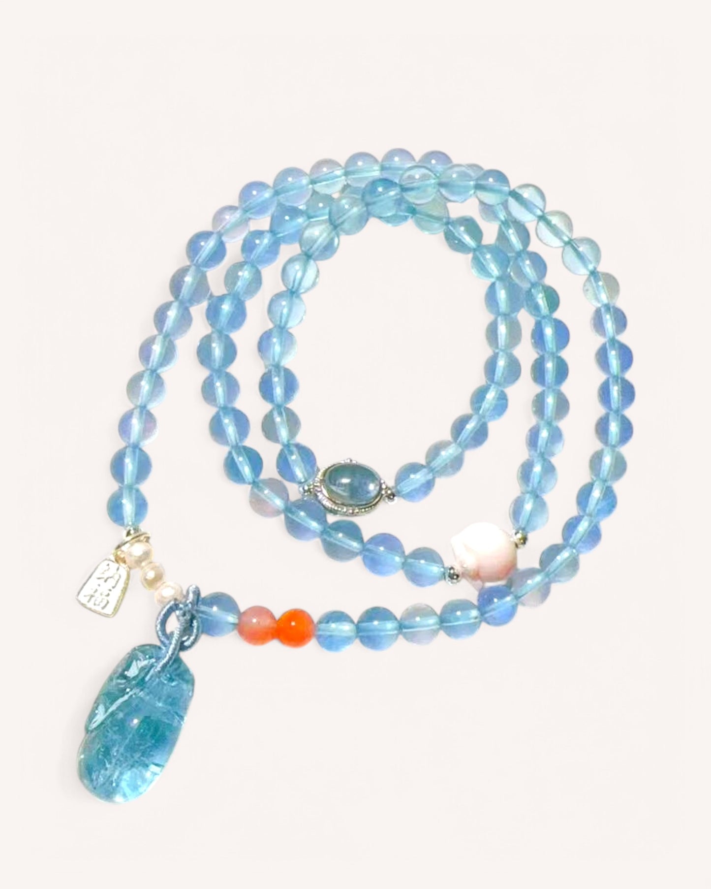 Aquamarine mala bracelet with South Red Agate and pink conch shell for emotional balance and spiritual clarity