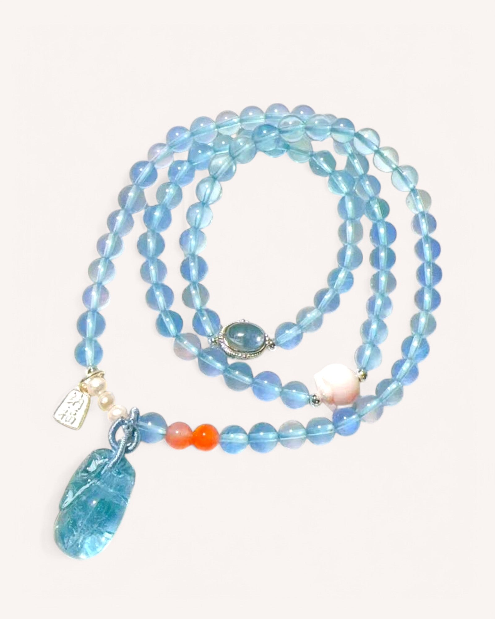 Aquamarine mala bracelet with South Red Agate and pink conch shell for emotional balance and spiritual clarity
