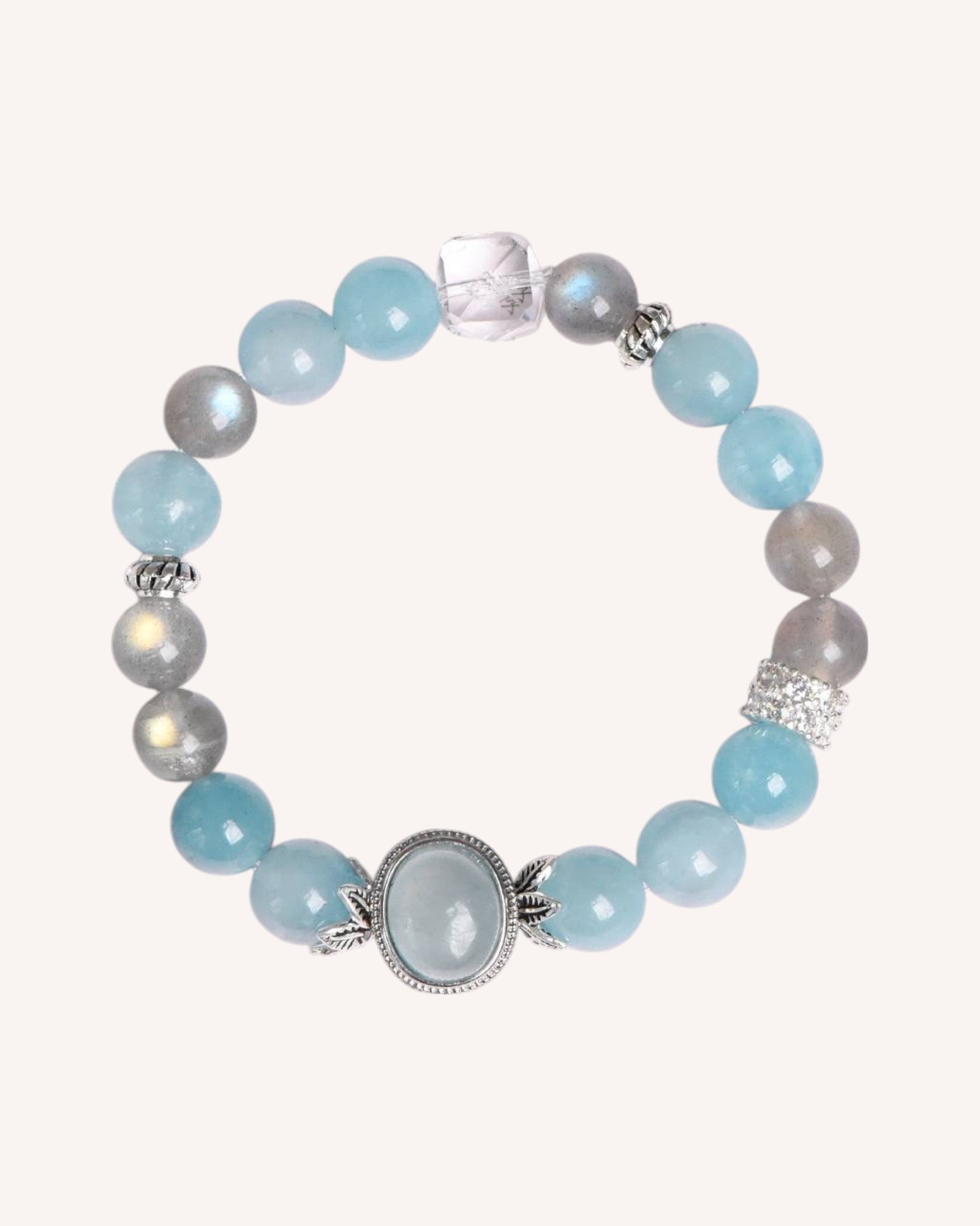 Close-up of Aquamarine, Gray Moonstone, and White Quartz healing bracelet for emotional clarity and intuition