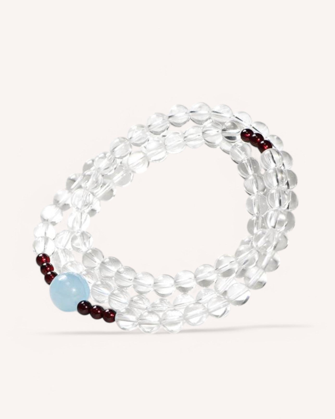 Multi-layer Aquamarine, White Quartz & Garnet Bracelet for energy balance, emotional clarity, and spiritual healing.