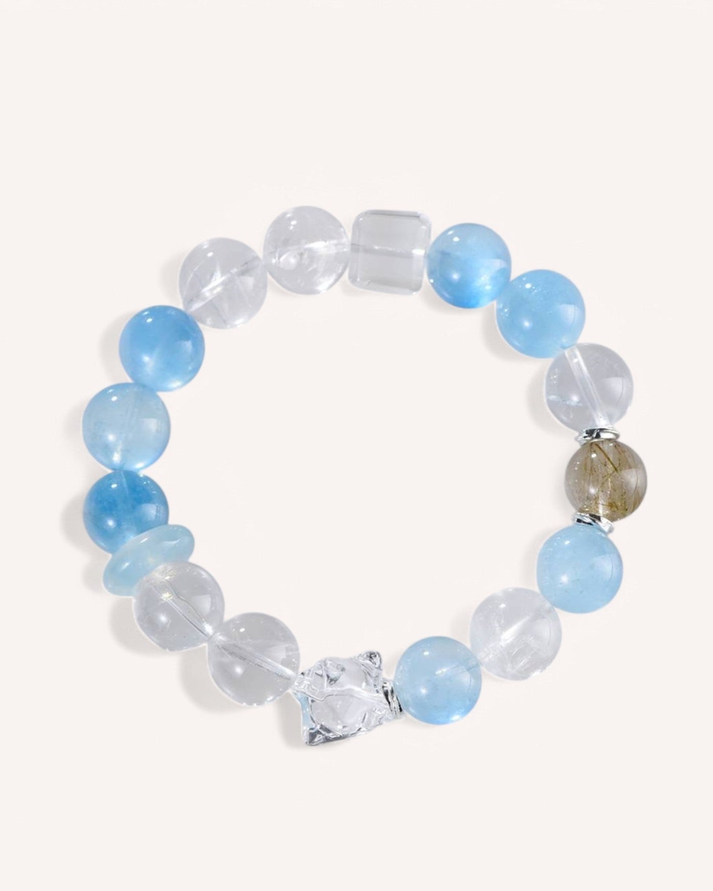 A stunning Aquamarine & White Quartz Bracelet with Rutilated Quartz accents, designed for emotional balance, mental clarity, and attracting prosperity.