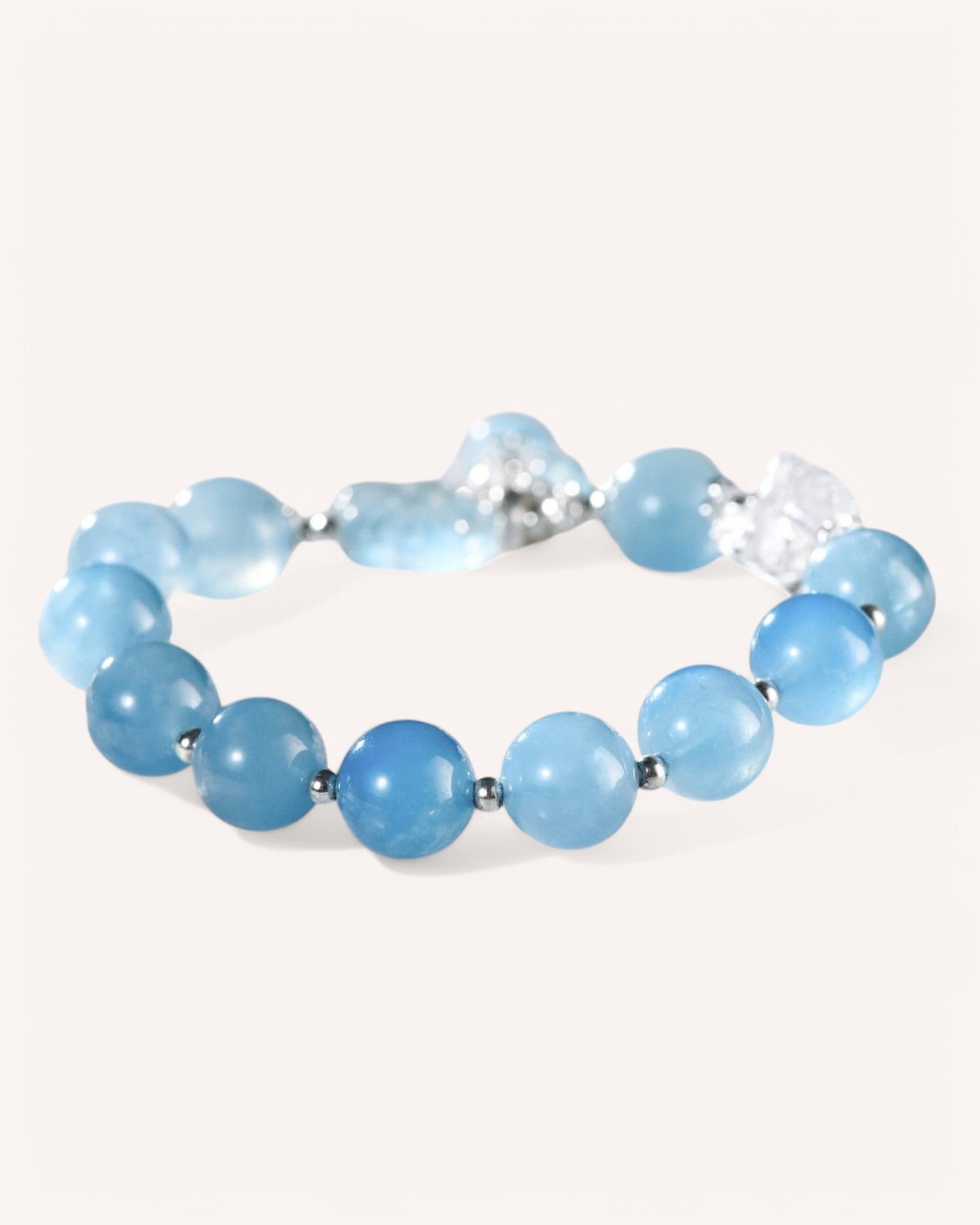 Flat lay of Aquamarine and White Quartz gemstone bracelet promoting inner peace, mental clarity, and spiritual harmony.