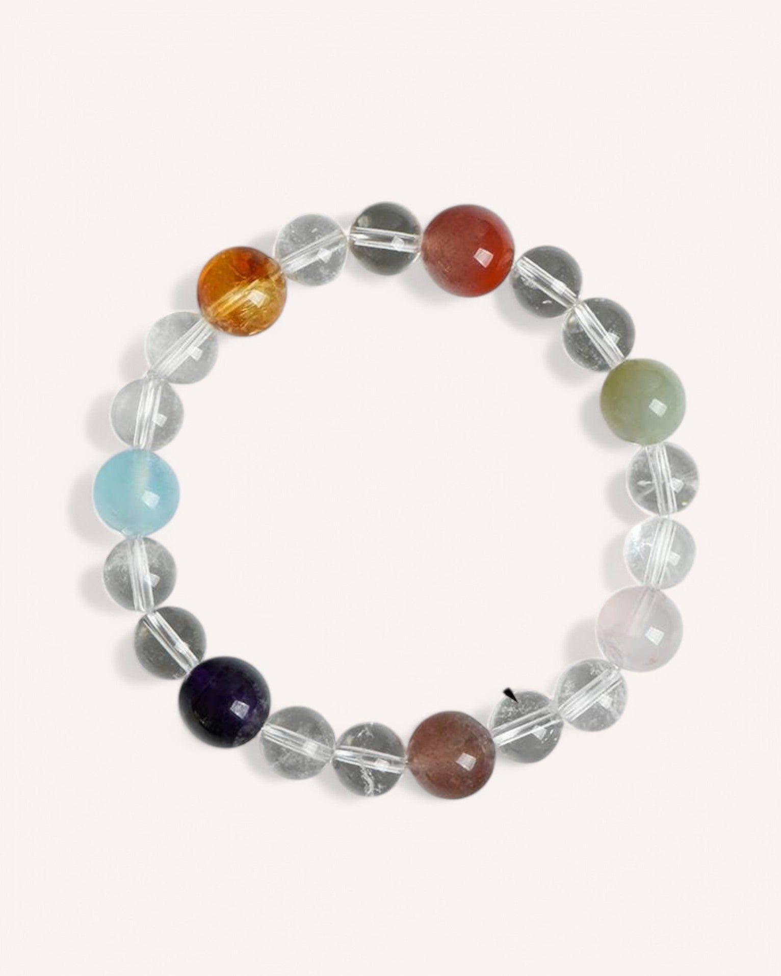Chakra Healing Bracelet with White Quartz and Multi-Gemstones for Energy Balance and Emotional Well-being. Features aquamarine, citrine, obsidian, red coral, and jade to align and activate chakras.