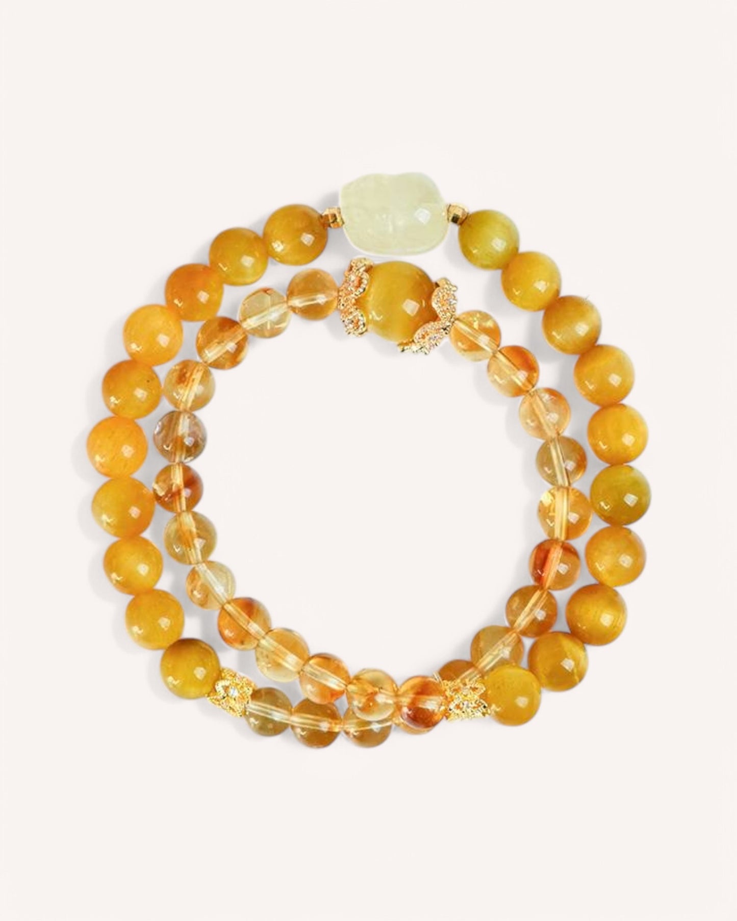 Citrine & Golden Tiger Eye Multi-Layer Bracelet – A triple-wrap prosperity bracelet designed to attract wealth, boost confidence, and enhance decision-making. Features a carved Pi Xiu charm for protection and fortune.