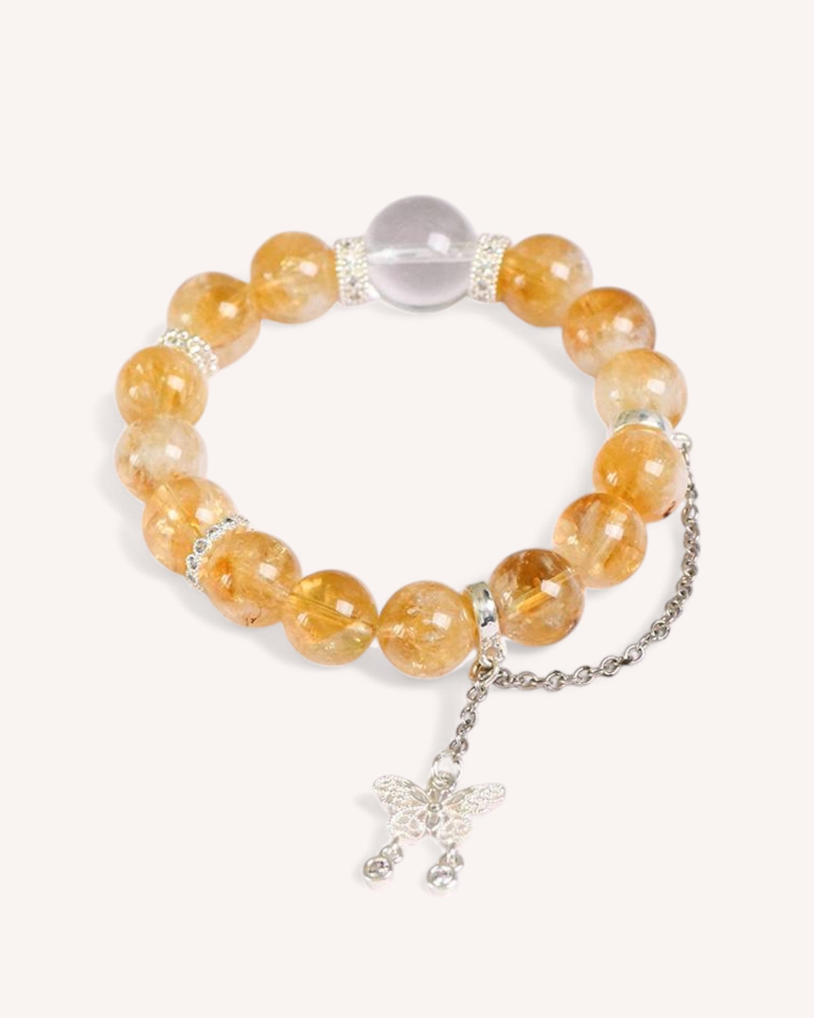 Citrine & White Quartz Butterfly Bracelet – A radiant crystal bracelet featuring Citrine for prosperity and White Quartz for clarity. The butterfly charm symbolizes transformation and new beginnings.