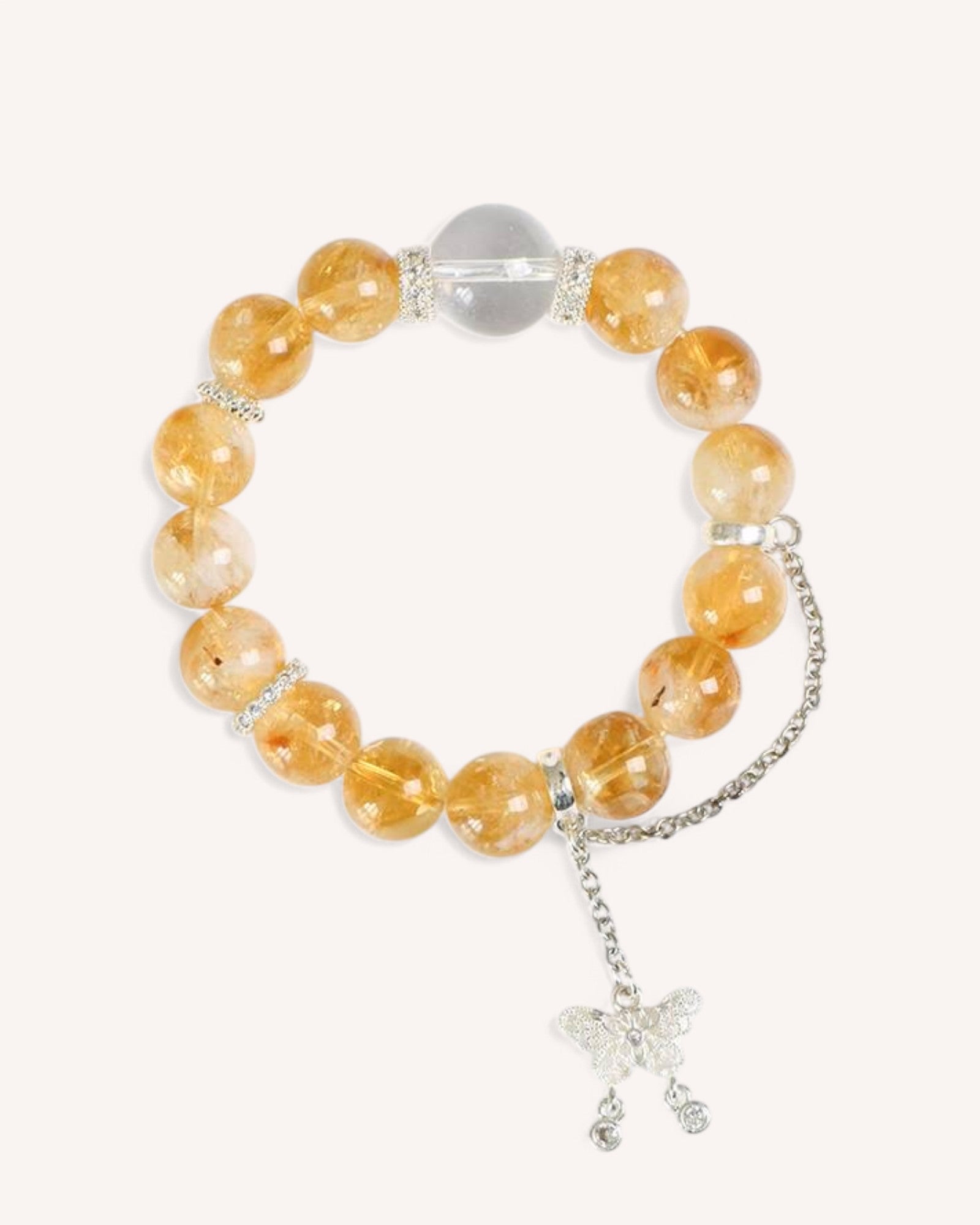 Citrine & White Quartz Transformation Bracelet – A handcrafted prosperity bracelet combining Citrine’s abundance energy with White Quartz’s clarity, finished with an elegant butterfly charm.