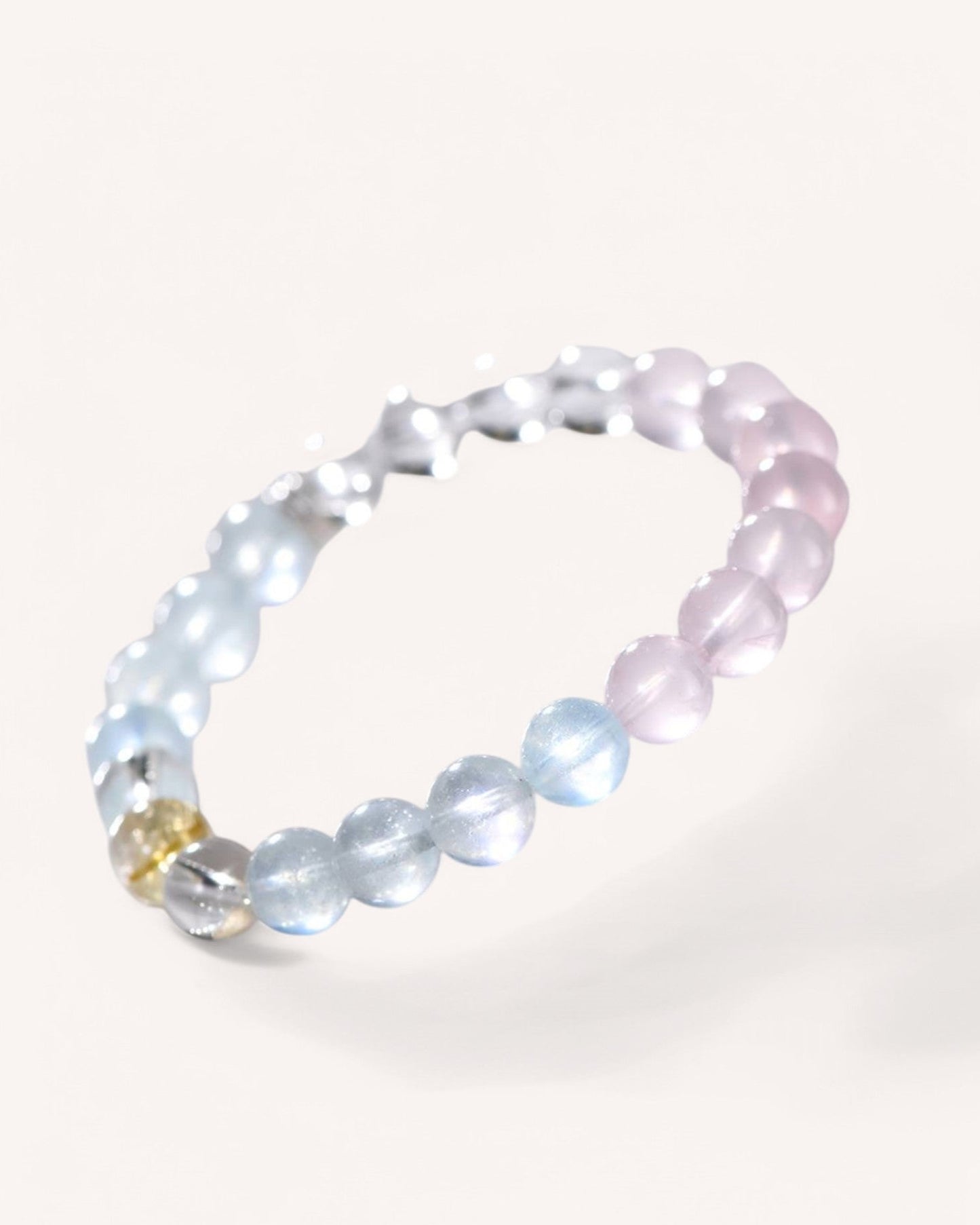 Side view of crystal bead bracelet featuring rose quartz, aquamarine, and citrine for promoting peace, confidence, and emotional clarity.