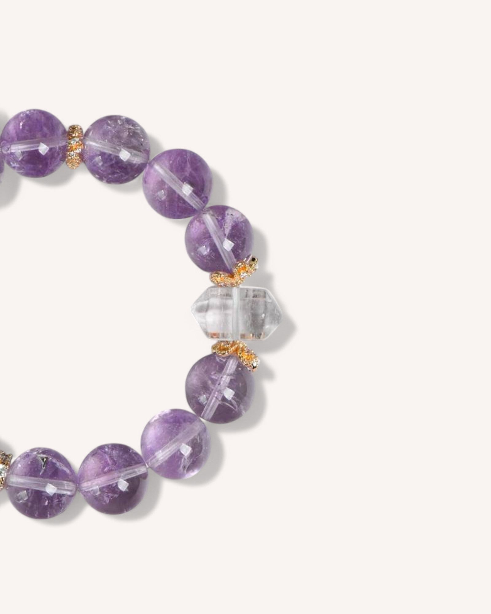 Detailed shot of Amethyst & White Quartz bracelet highlighting the healing properties of the double-point crystal for intuition and energy alignment.