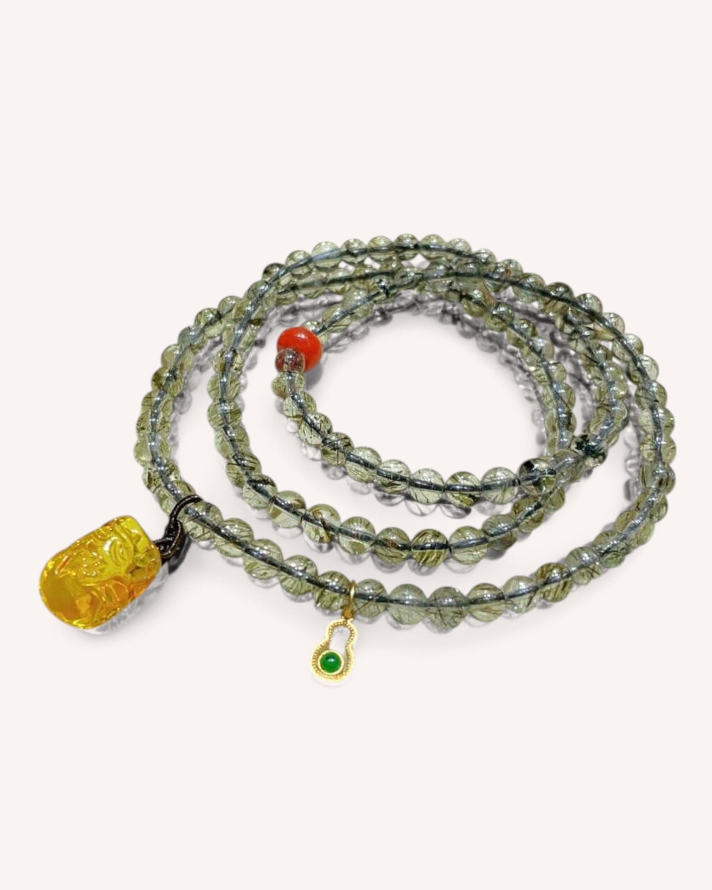 Main product image of multi-layer bracelet made with Black Gold Super Seven, Honey Amber, and South Red Agate, designed for grounding and prosperity.