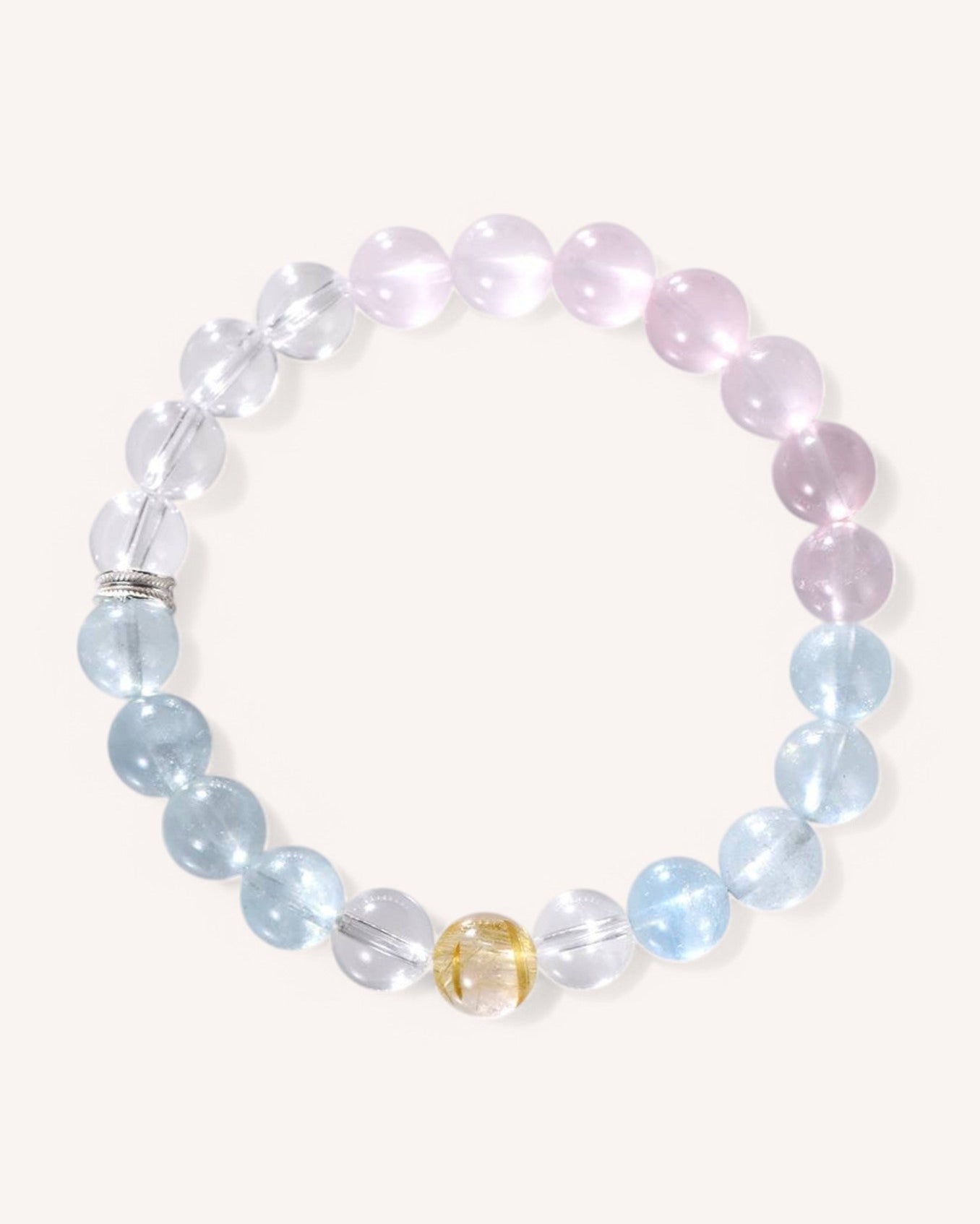 Healing crystal bracelet made of rose quartz, aquamarine, and citrine designed for emotional healing, love, intuition, and stress relief.