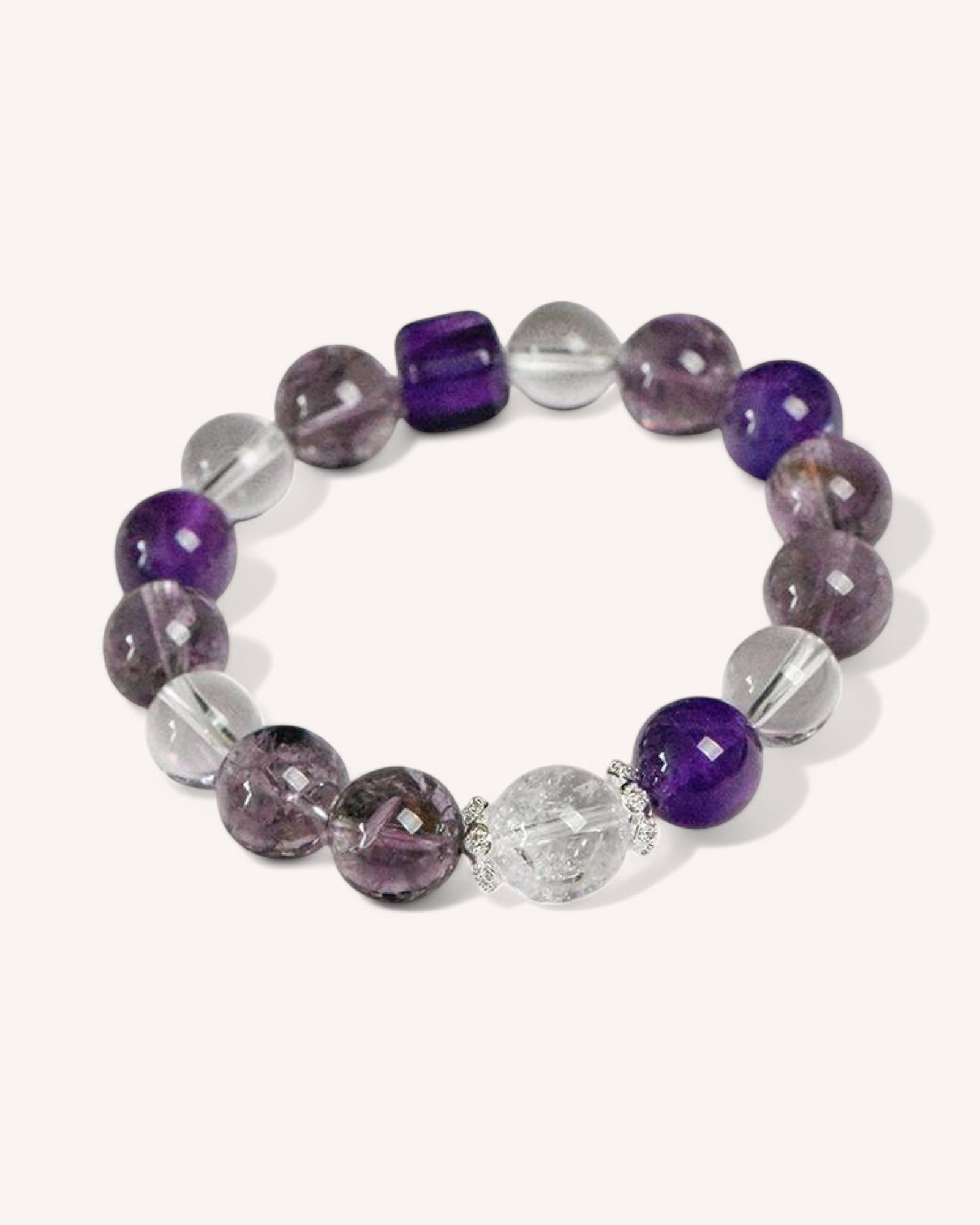 Healing crystal bracelet with a mix of amethyst, white quartz, and alloy accents, symbolizing focus, energy balance, and mindfulness.