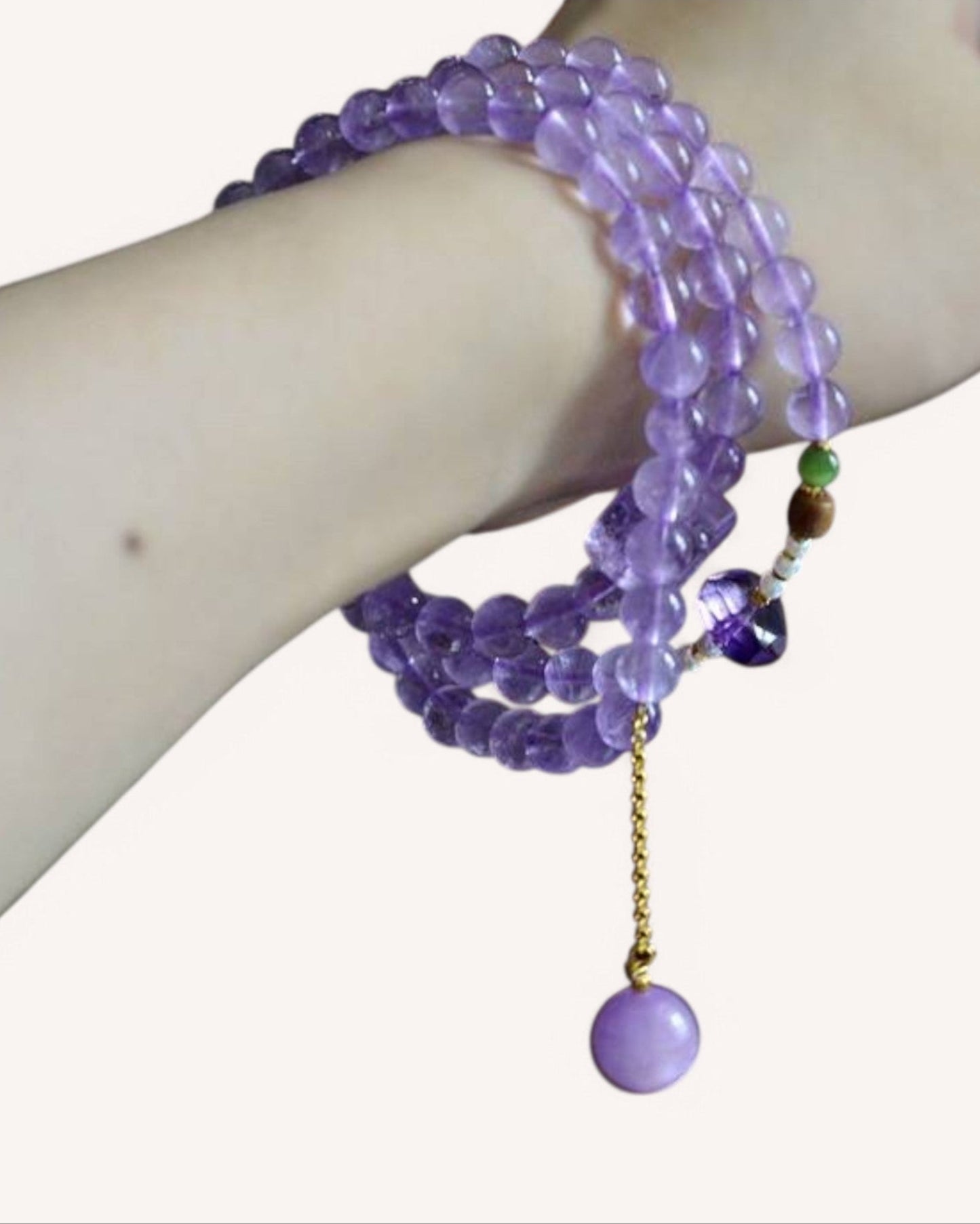 A wrist view of the Lavender Amethyst Meditation Bracelet, designed for relaxation, energy balance, and mindfulness, featuring a soft purple hue with elegant gold spacers.