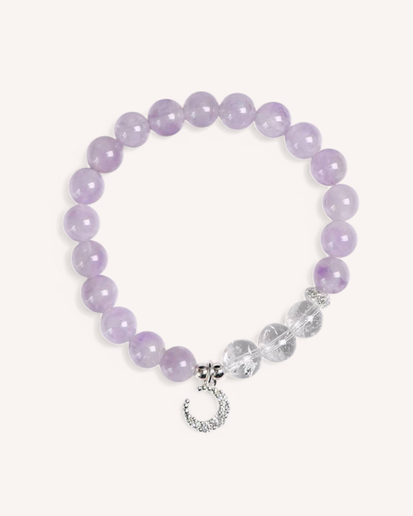 Close-up of the Lavender Amethyst & White Quartz Moon Charm Bracelet, featuring soft purple amethyst beads, white quartz accents, and a delicate silver moon pendant for intuition and emotional healing.