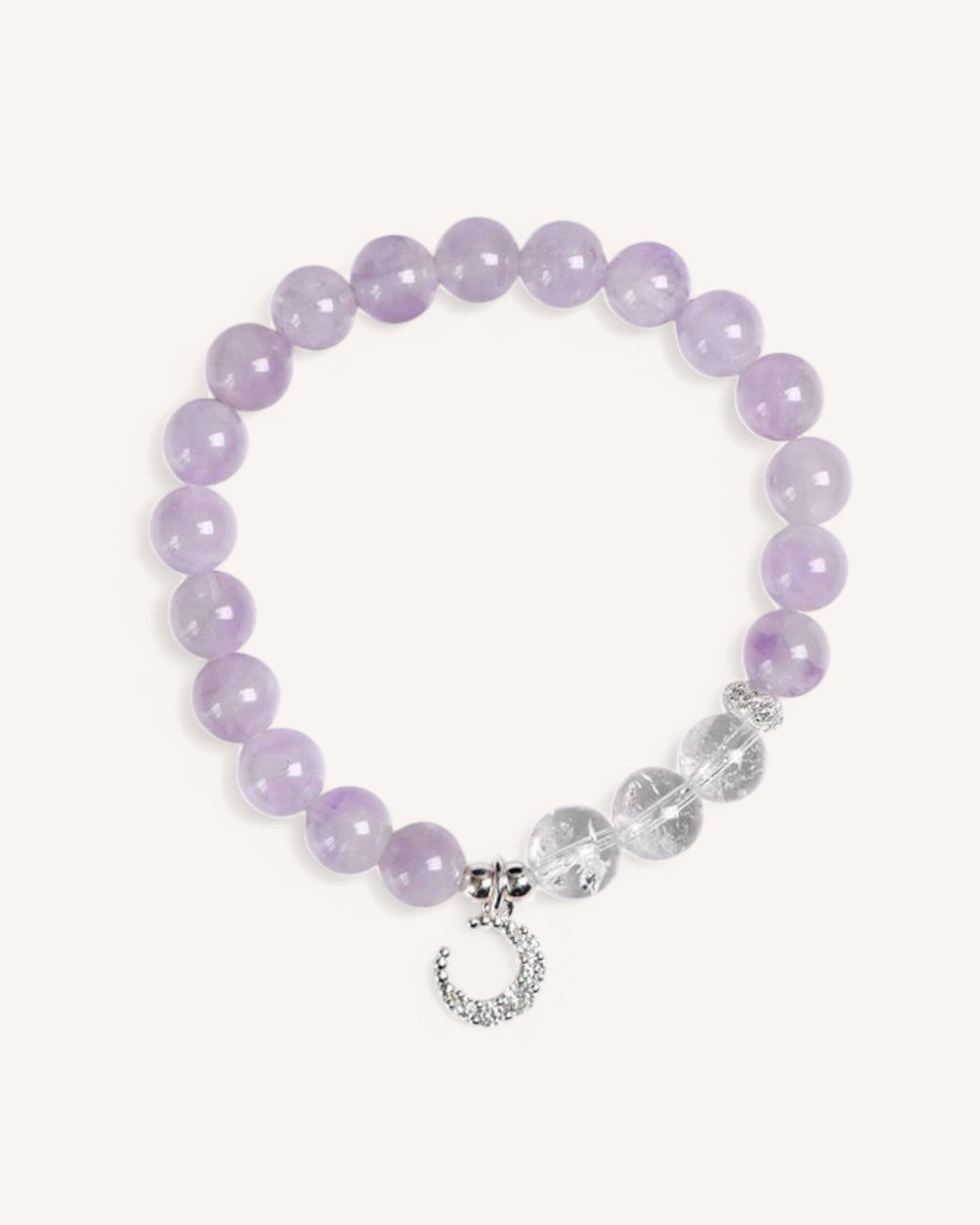 Close-up of the Lavender Amethyst & White Quartz Moon Charm Bracelet, featuring soft purple amethyst beads, white quartz accents, and a delicate silver moon pendant for intuition and emotional healing.