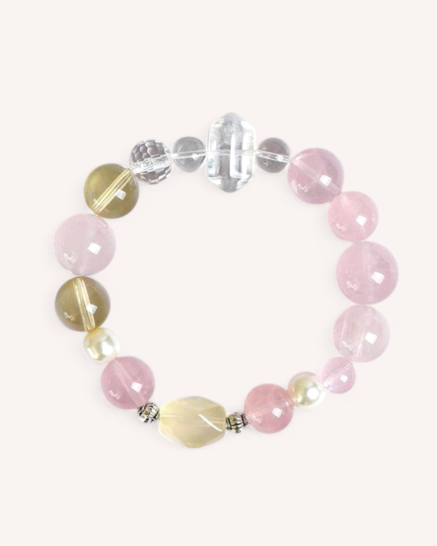 Love & Abundance Bracelet featuring Rose Quartz, Citrine, and White Quartz, designed to enhance love, emotional healing, and prosperity with a double-terminated crystal.