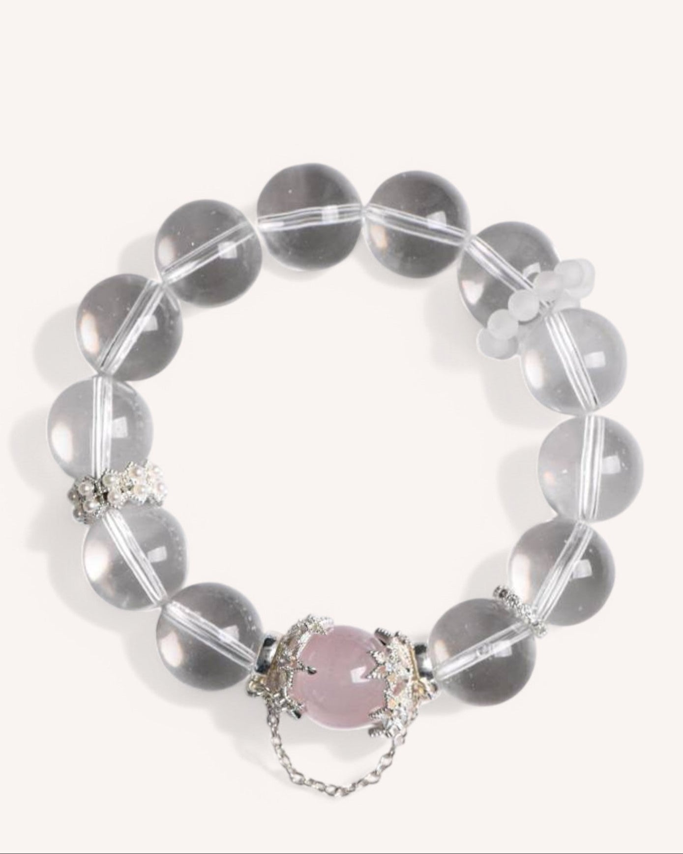 Close-up of the Love & Clarity Rose Quartz Bracelet featuring white crystal and a heart-shaped rose quartz centerpiece, symbolizing love, healing, and energy balance.