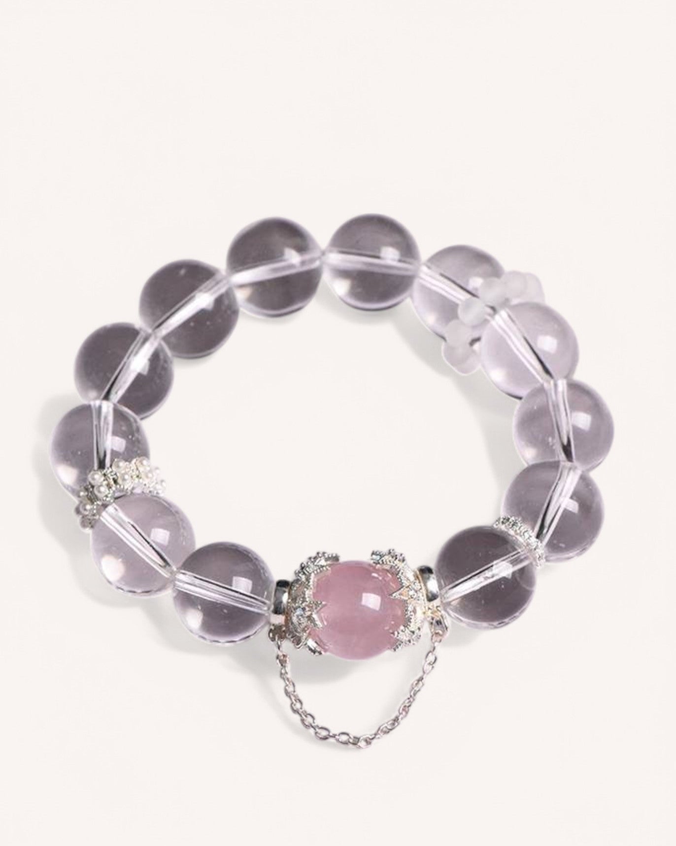 Top view of the Love & Clarity Rose Quartz Bracelet with white crystal and a heart-shaped rose quartz stone, promoting love, self-care, and spiritual clarity.