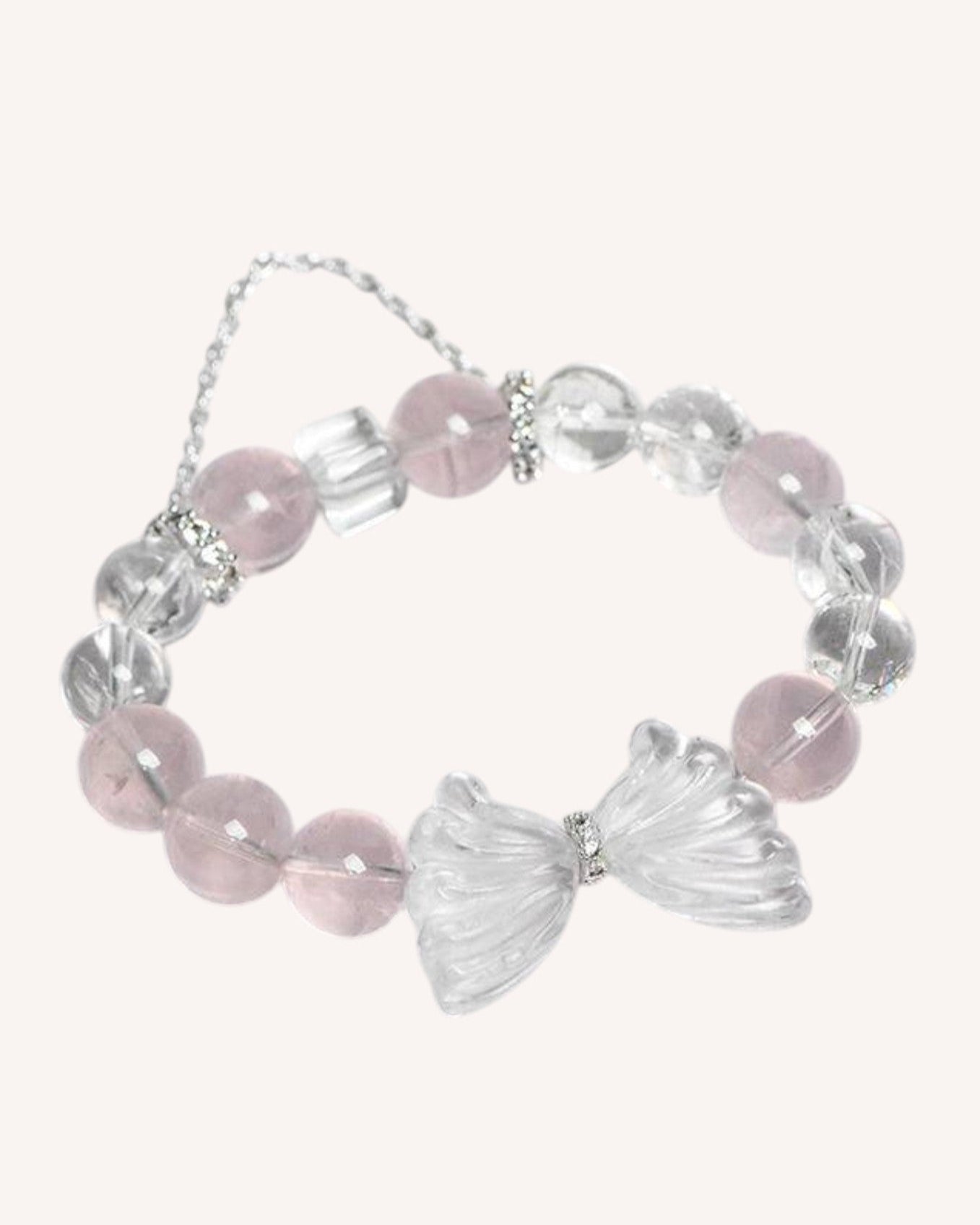Side view of the Love & Clarity Rose Quartz Butterfly Bracelet, showcasing its delicate design with healing rose quartz and white quartz, along with a butterfly charm that promotes self-love, emotional clarity, and new beginnings.