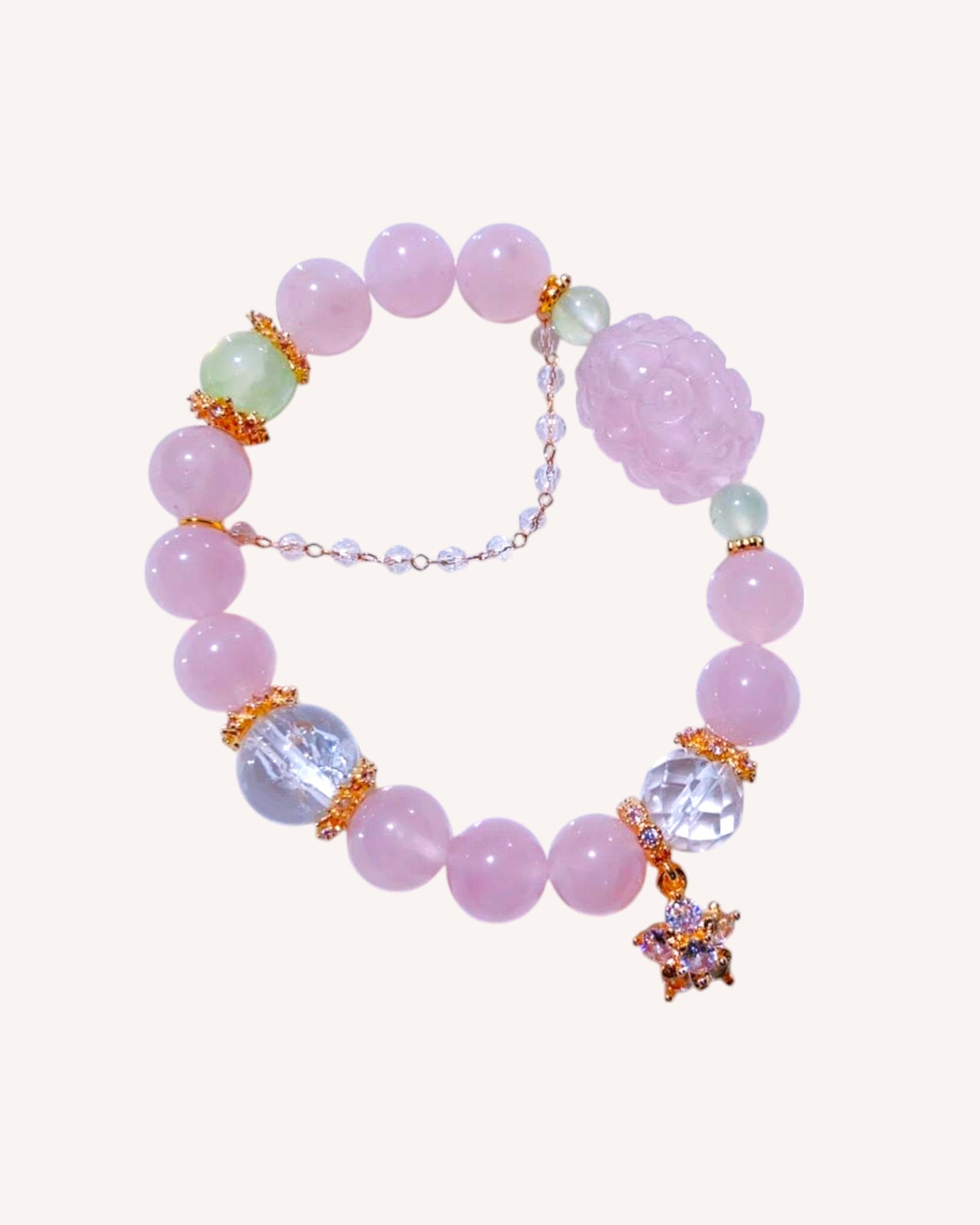 Rose Quartz and Prehnite bracelet for emotional healing, confidence, and energy balance, featuring a fox charm and faceted white quartz beads.

