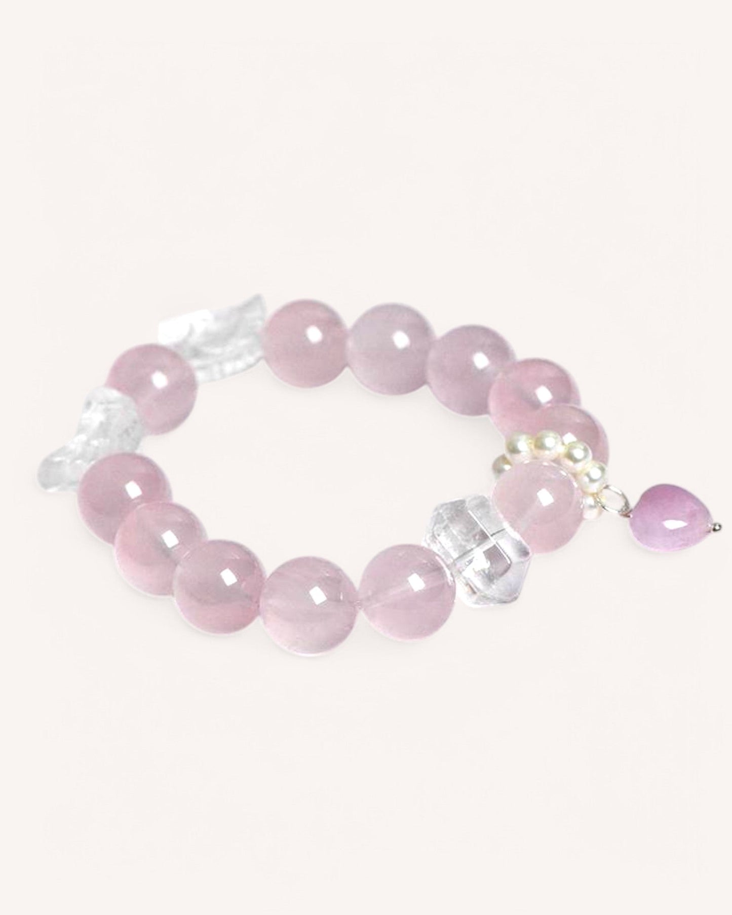 Love & Protection Bracelet with Rose Quartz and White Quartz, featuring an angel wing charm for spiritual guidance, emotional healing, and balance.